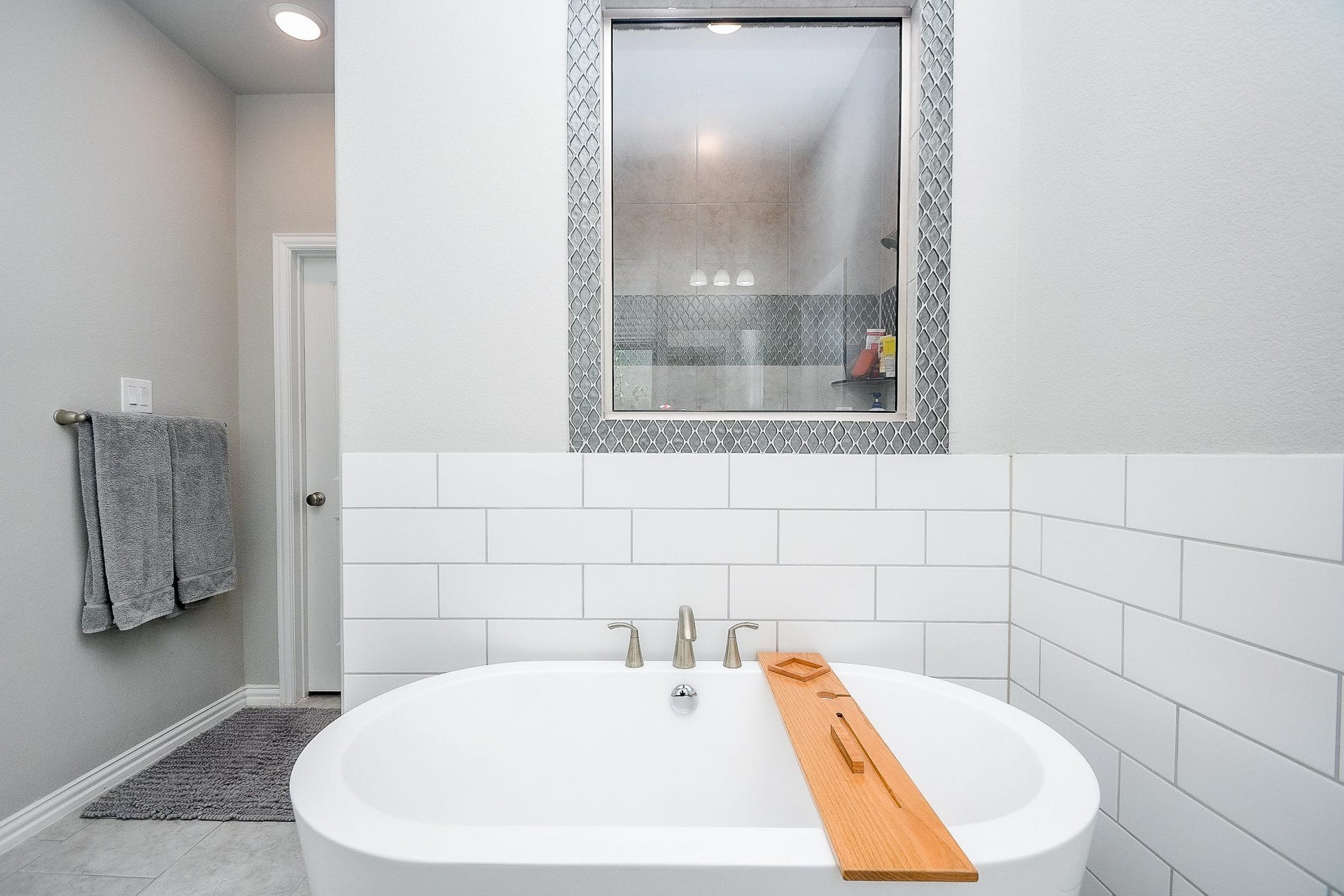 2703 Ripe Amber Cup Court, Richmond, TX 77406 Dual sink layout with quartz countertops, center vanity area and large window bringing natural light into the primary bath.