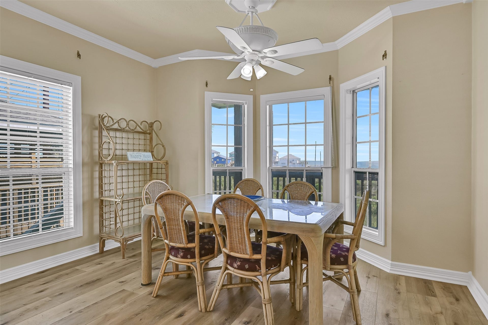 22329 Vista Del Mar, Galveston, TX 77554 The dining room with walls of windows that brighten up the space. The table currently offers seating for 6.