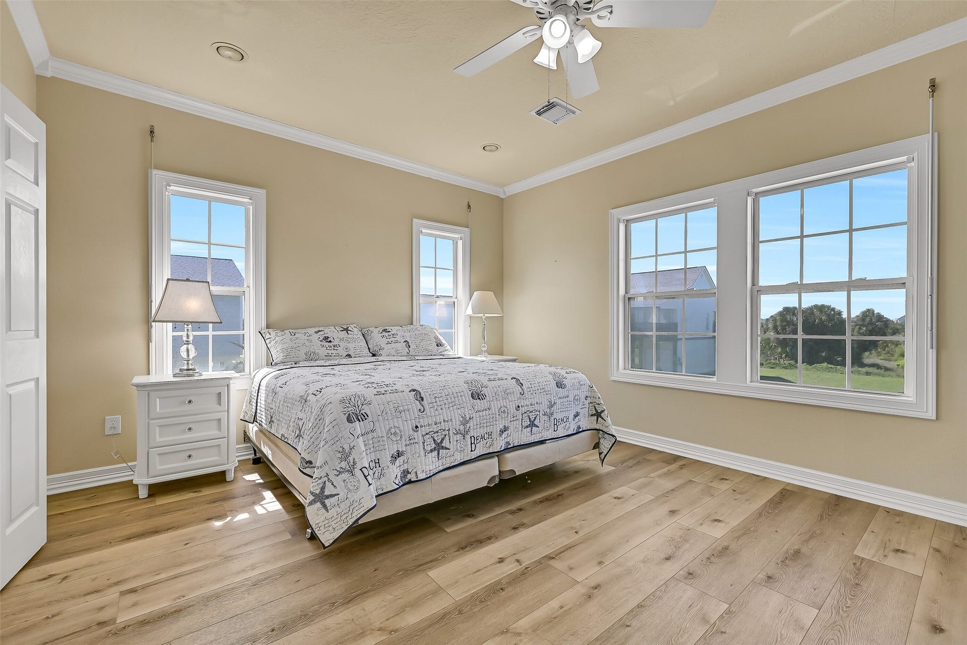 22329 Vista Del Mar, Galveston, TX 77554 The last bedroom you will come across is the spacious primary suite with en-suite bathroom. This room features high ceilings, walls of windows, and can easily accommodate different furniture layouts.