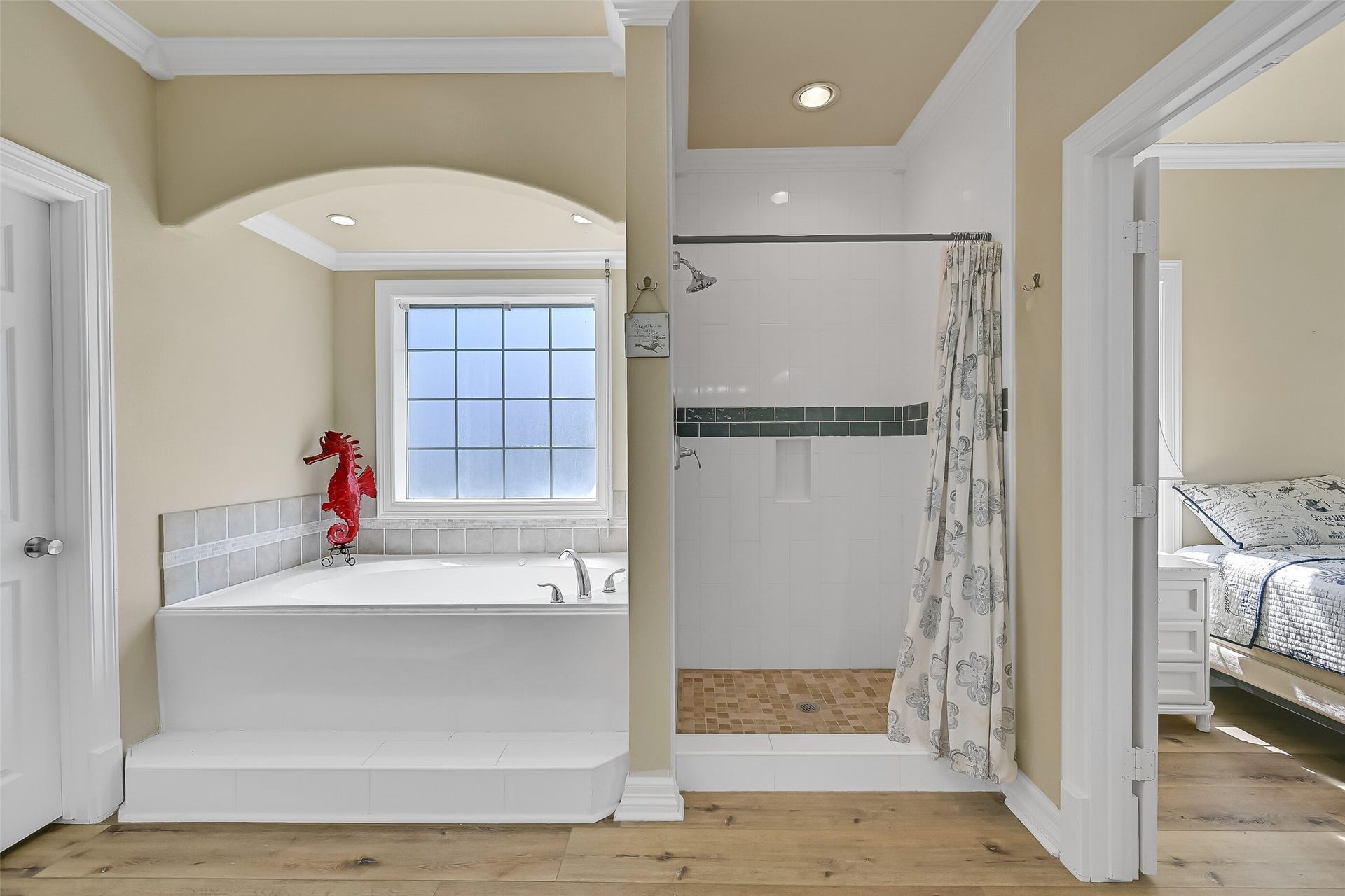 22329 Vista Del Mar, Galveston, TX 77554 The bathroom is complete with a jetted tub, shower, toilet closet, and walk-in closet.
