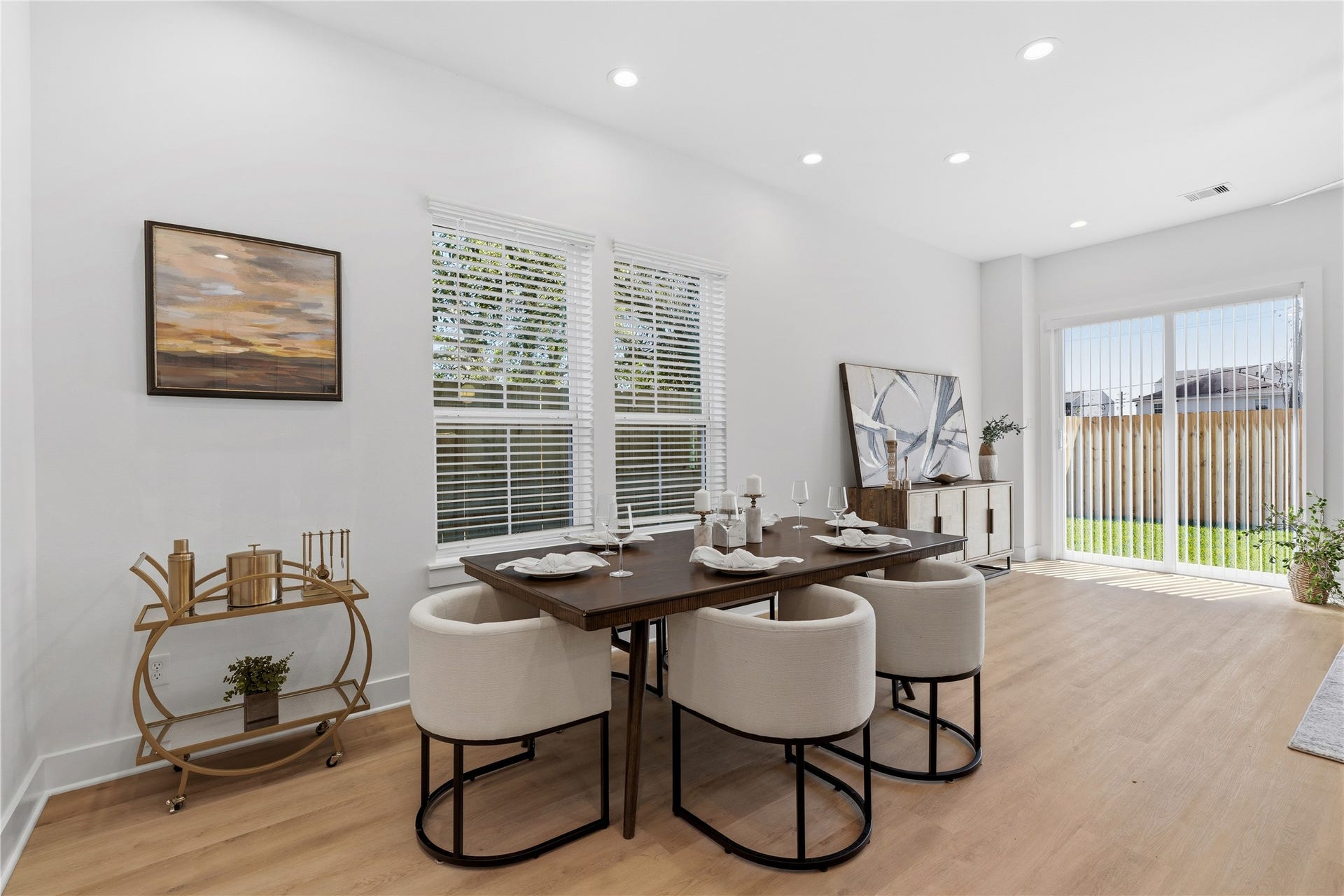 Open-concept single-family living space with 10 ceilings, defined seating area, and easy flow into the kitchen and dining.