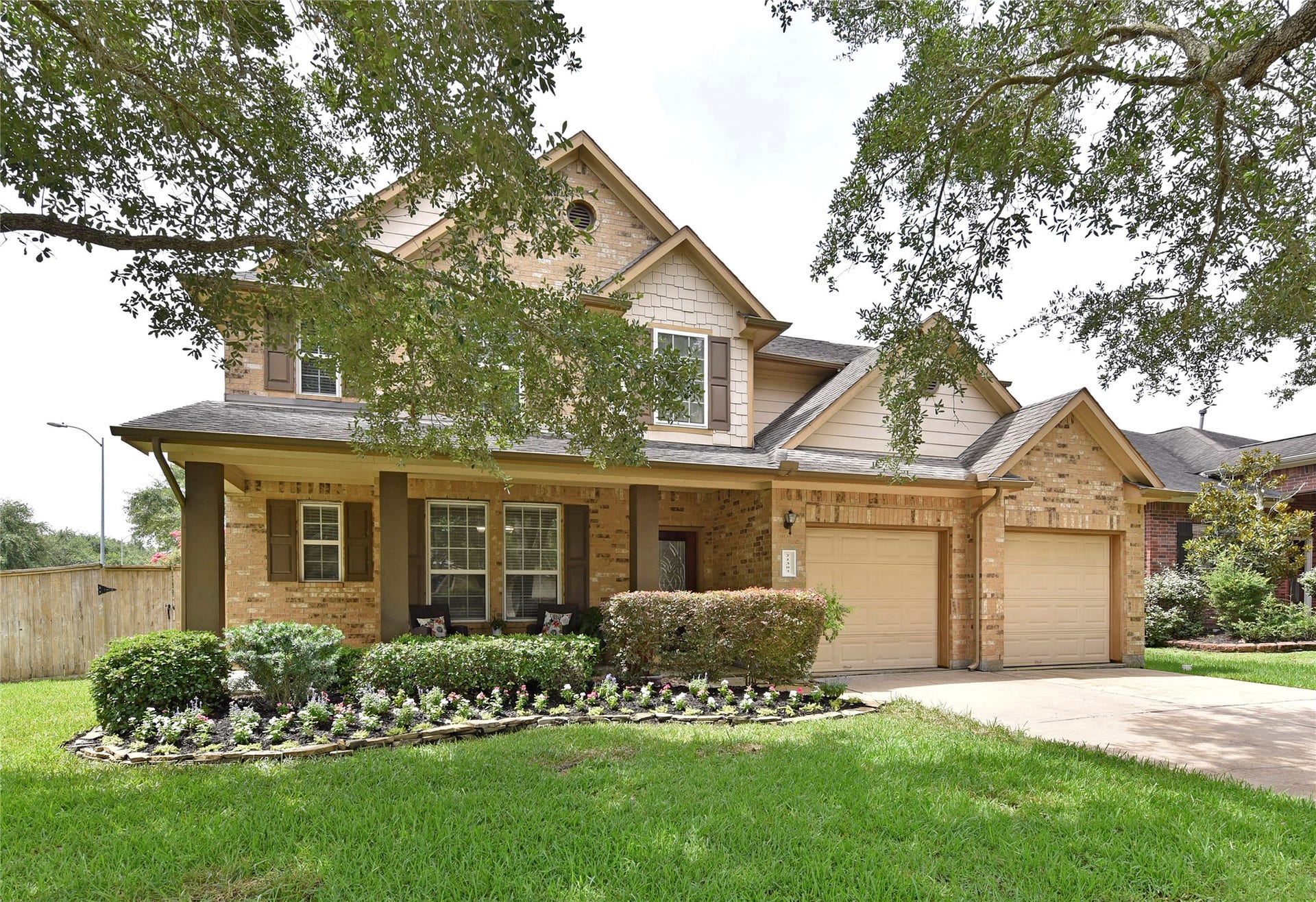 21303 Beverly Chase Drive, Richmond, TX 77406 From the beautiful landscaping to the covered from porch this curb appeal is lovely.