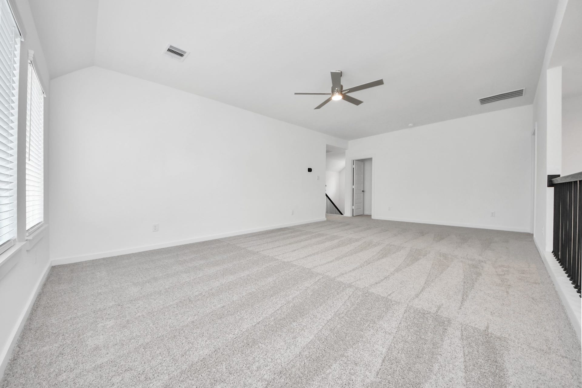 24511 Broad Park Ct, Spring, TX 77373 Come upstairs and enjoy a day of leisure in this fabulous game room! This is the perfect hangout spot or adult game room! Features plush carpet, high ceilings, custom paint and windows for plenty of natural light. Sample photo of completed home with similar floor plan. Actual colors and selections may vary.