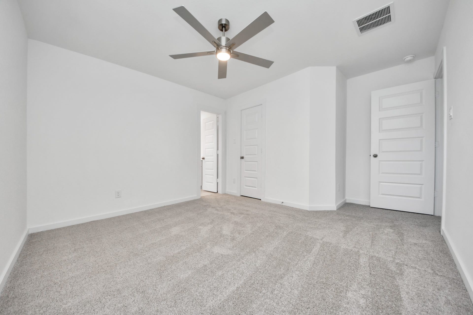 24511 Broad Park Ct, Spring, TX 77373 Secondary bedroom features plush carpeting, large windows that let in plenty of natural light, bright paint, and spacious closets. Sample photo of completed home with similar floor plan. Actual colors and selections may vary.