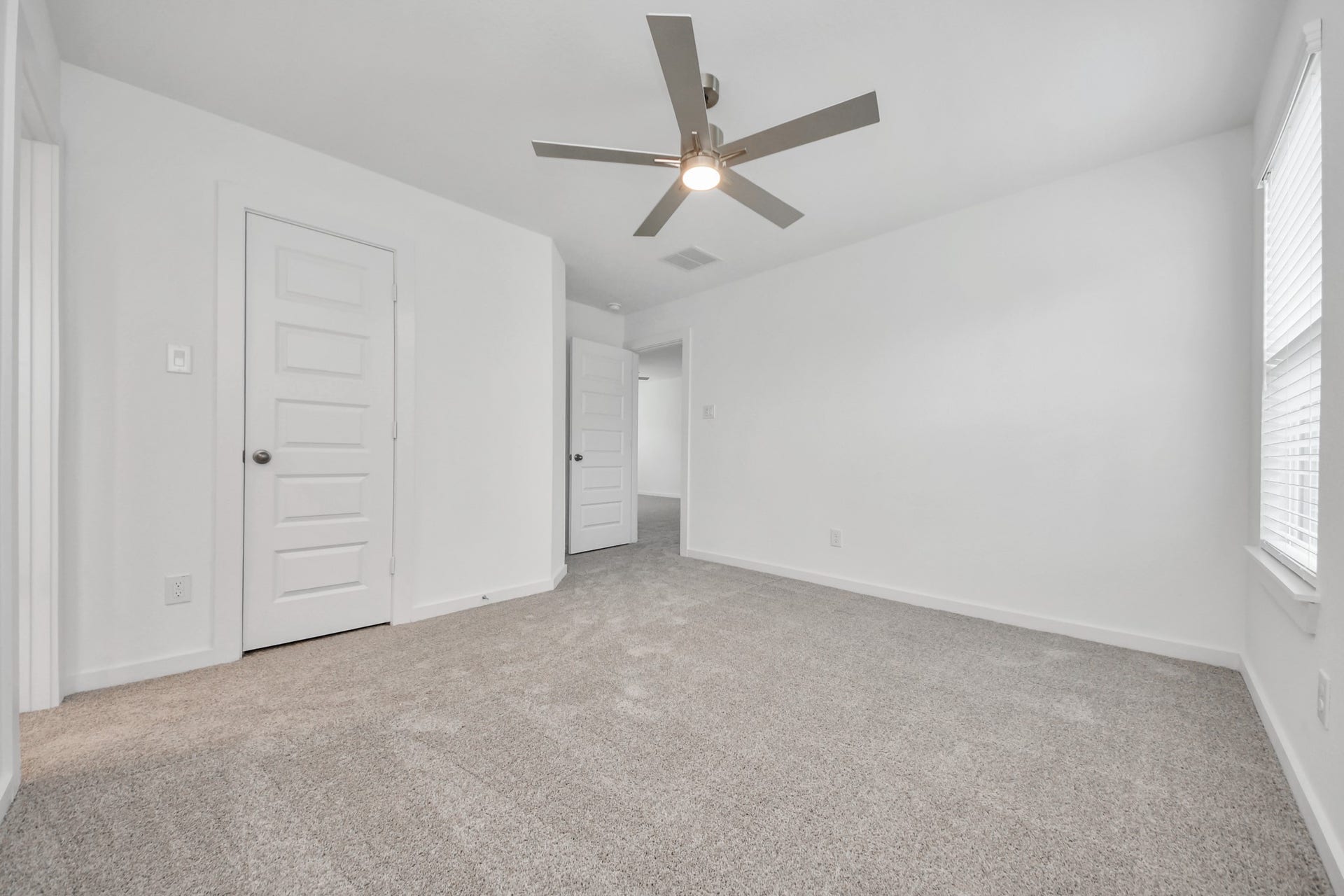 24511 Broad Park Ct, Spring, TX 77373 Generously sized secondary bedrooms featuring spacious closets, soft and inviting carpeting underfoot, large windows allowing plenty of natural light, and the added touch of privacy blinds for your personal retreat. Sample photo of completed home with similar floor plan. Actual colors and selections may vary.