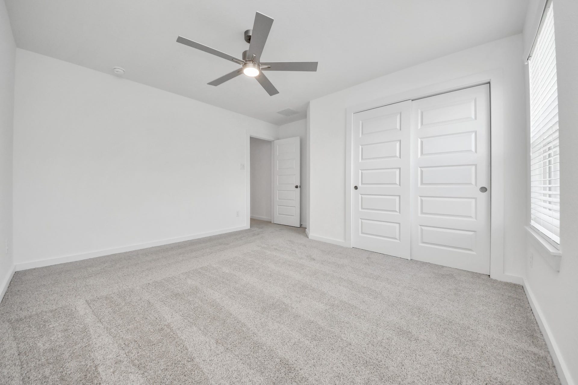 24511 Broad Park Ct, Spring, TX 77373 Generously sized secondary bedrooms featuring spacious closets, soft and inviting carpeting underfoot, large windows allowing plenty of natural light, and the added touch of privacy blinds for your personal retreat. Sample photo of completed home with similar floor plan. Actual colors and selections may vary.