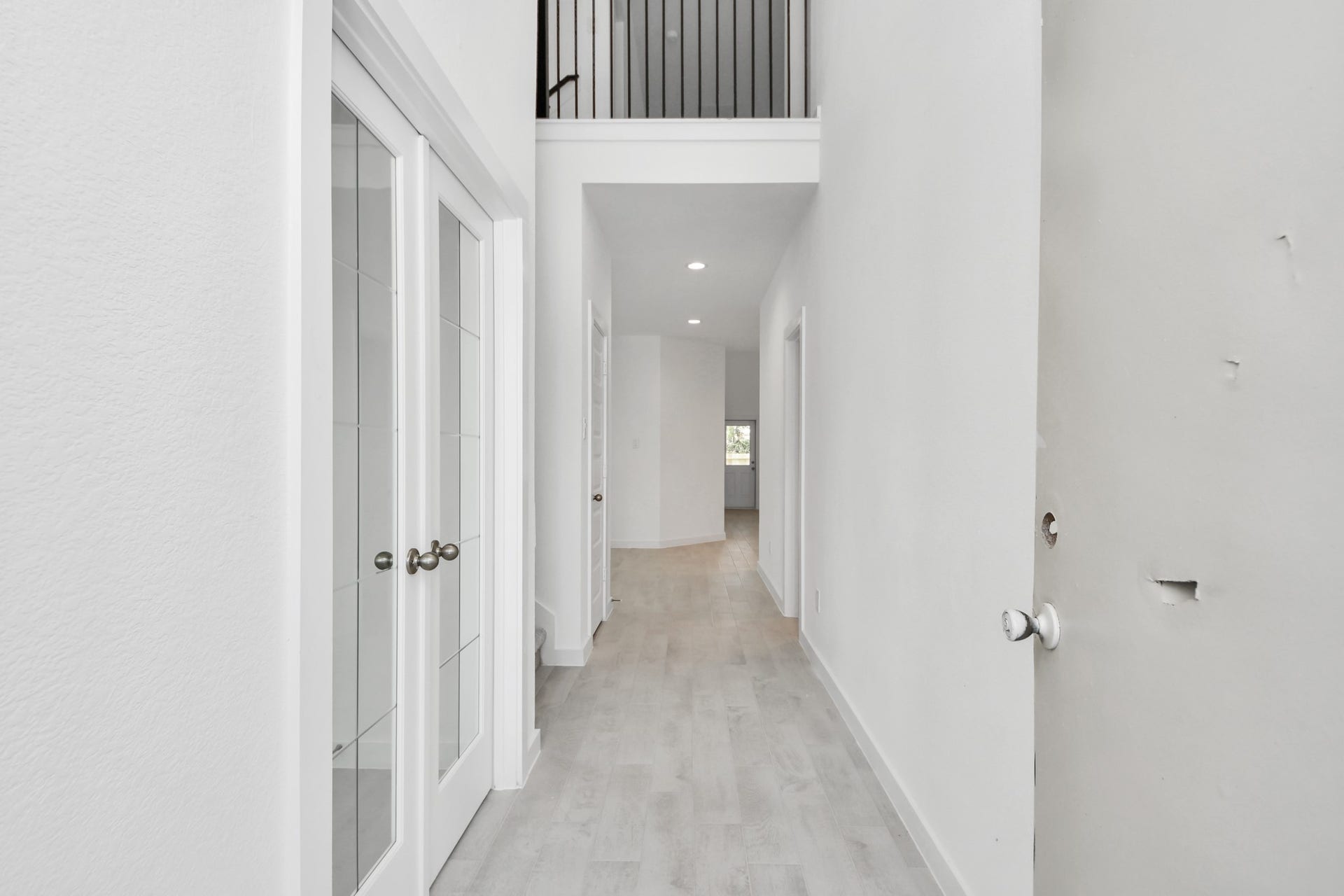 24511 Broad Park Ct, Spring, TX 77373 As you step into the threshold of this luxurious home, you'll soon be welcomed by an elegant glass door (to be installed). Inside, soaring ceilings amplify the spaciousness, while the refined wood-look tile flooring and oversized baseboards exude sophistication and charm. Sample photo of completed home with similar floor plan. Actual colors and selections may vary.