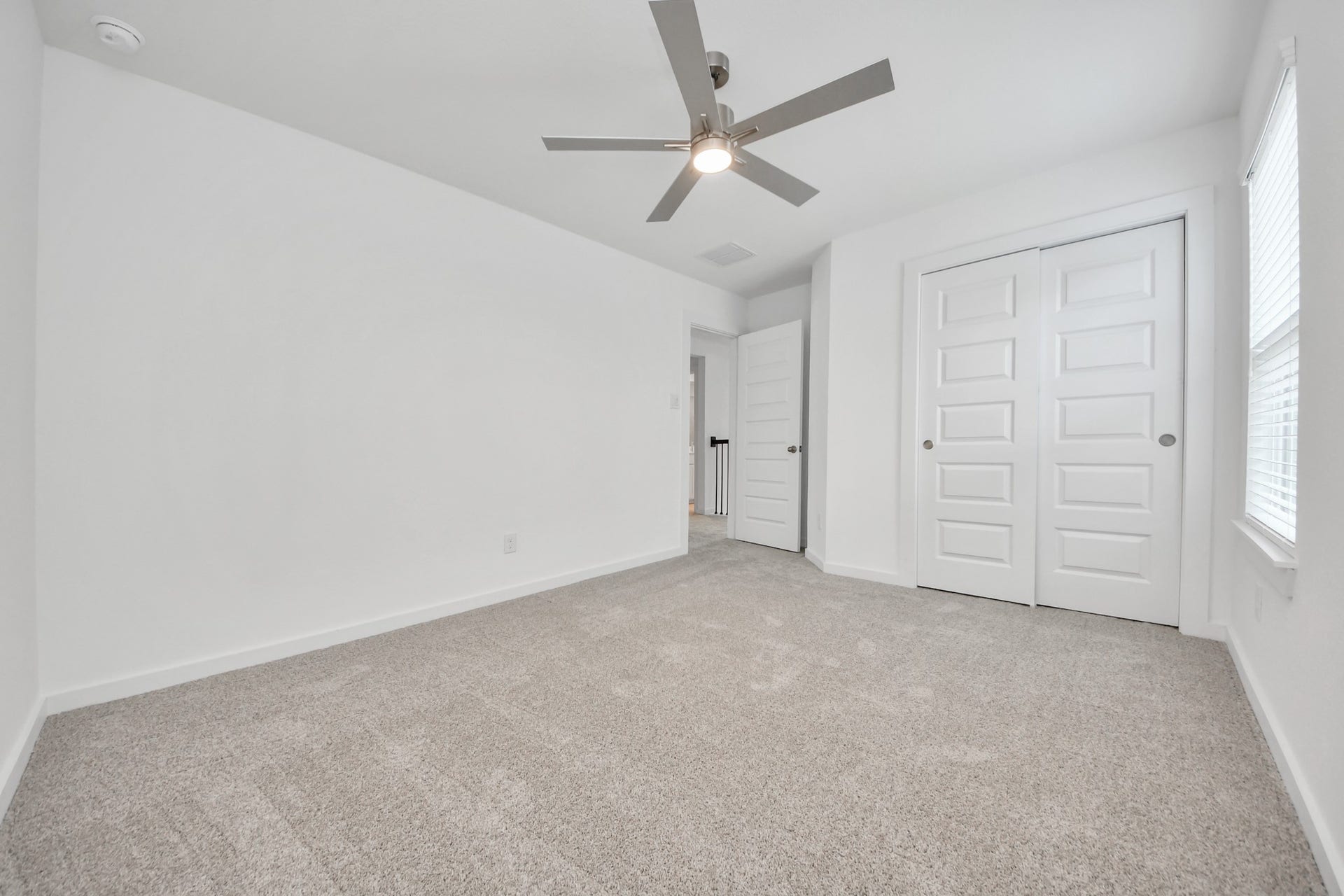 24511 Broad Park Ct, Spring, TX 77373 Generously sized secondary bedrooms featuring spacious closets, soft and inviting carpeting underfoot, large windows allowing plenty of natural light, and the added touch of privacy blinds for your personal retreat. Sample photo of completed home with similar floor plan. Actual colors and selections may vary.