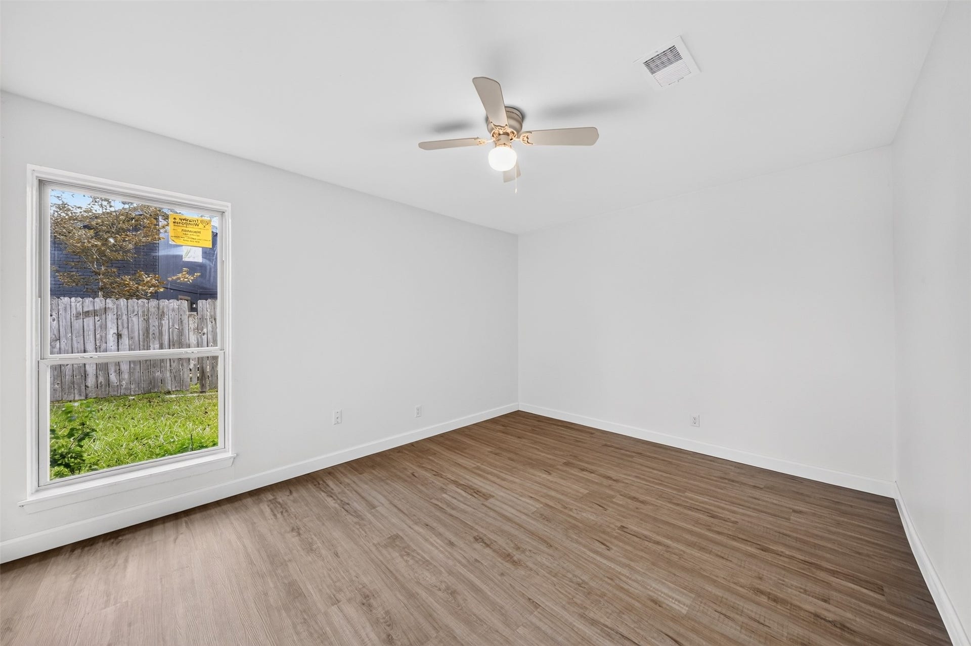 1826 Hilton Head Drive, Missouri City, TX 77459 Spacious second bedroom with a large window that fills the room with natural sunlight.