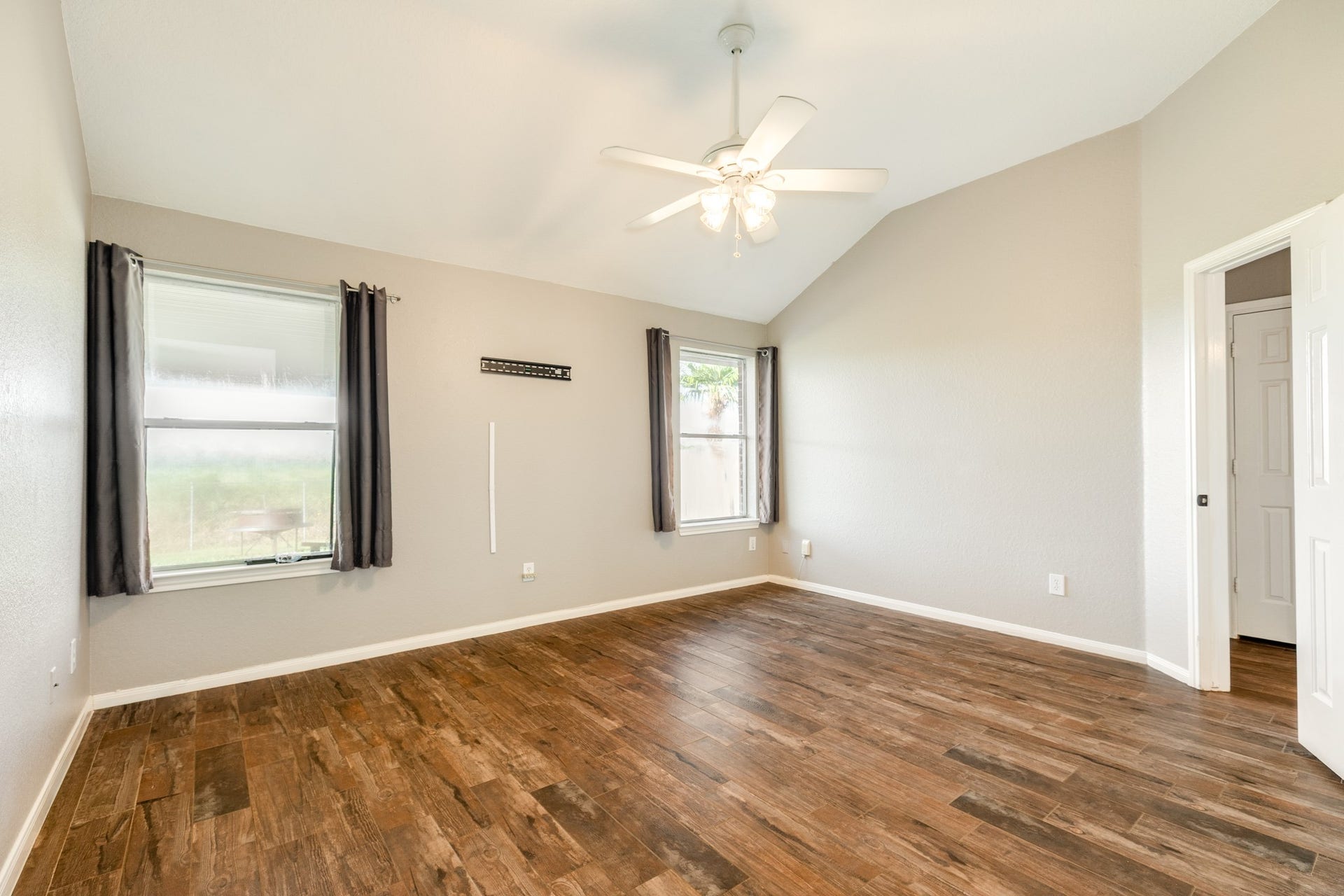 3425 Van Ness Drive, Alvin, TX 77511 Roomy primary bedroom with backyard outdoor views