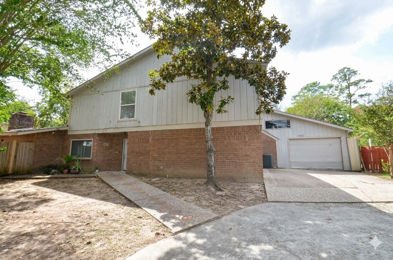 17821 S Cypress Villas Drive, Spring, TX 77379 Welcome to your new home! Exterior view of a two-story home featuring classic brick and siding.