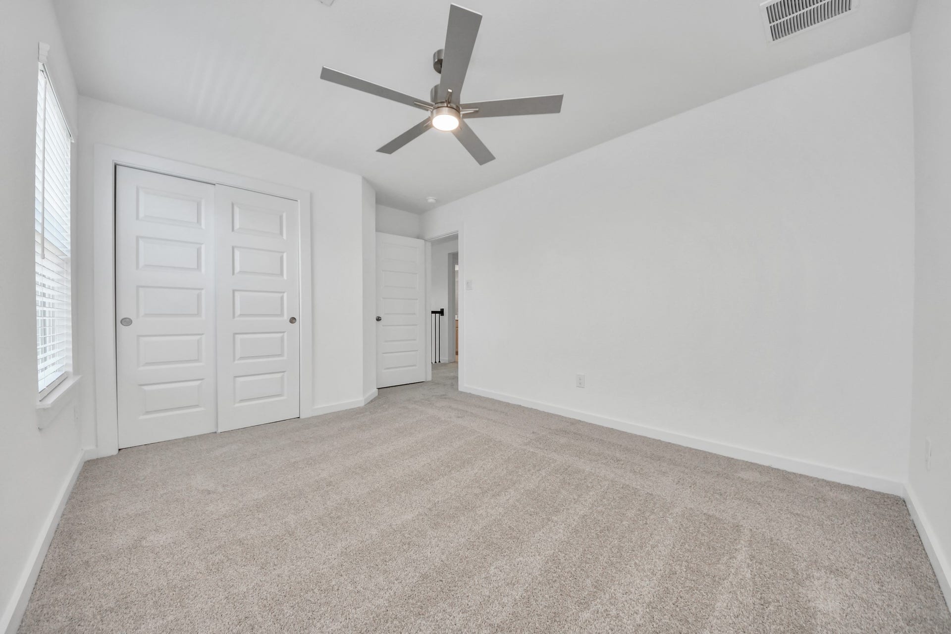 2203 Demeter Place, Fresno, TX 77545 Generously sized secondary bedrooms featuring spacious closets, soft and inviting carpeting underfoot, large windows allowing plenty of natural light, and the added touch of privacy blinds for your personal retreat. Sample photo of completed home with similar floor plan. Actual colors and selections may vary.