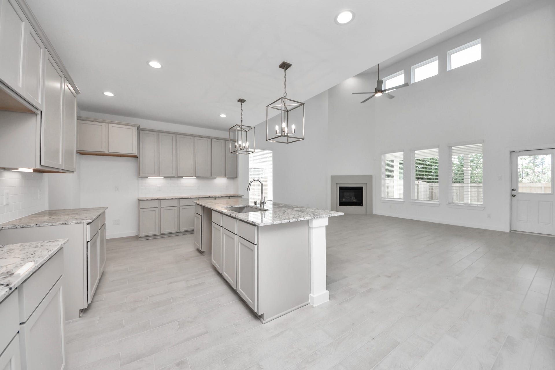2203 Demeter Place, Fresno, TX 77545 The kitchen is a culinary haven, featuring granite countertops, a tile backsplash, stainless steel appliances, 42 upper cabinets, and undercabinet lighting. Sample photo of completed home with similar floor plan. Actual colors and selections may vary.
