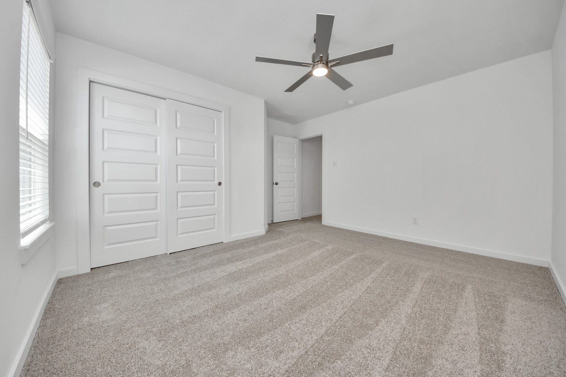 2203 Demeter Place, Fresno, TX 77545 Generously sized secondary bedrooms featuring spacious closets, soft and inviting carpeting underfoot, large windows allowing plenty of natural light, and the added touch of privacy blinds for your personal retreat. Sample photo of completed home with similar floor plan. Actual colors and selections may vary.