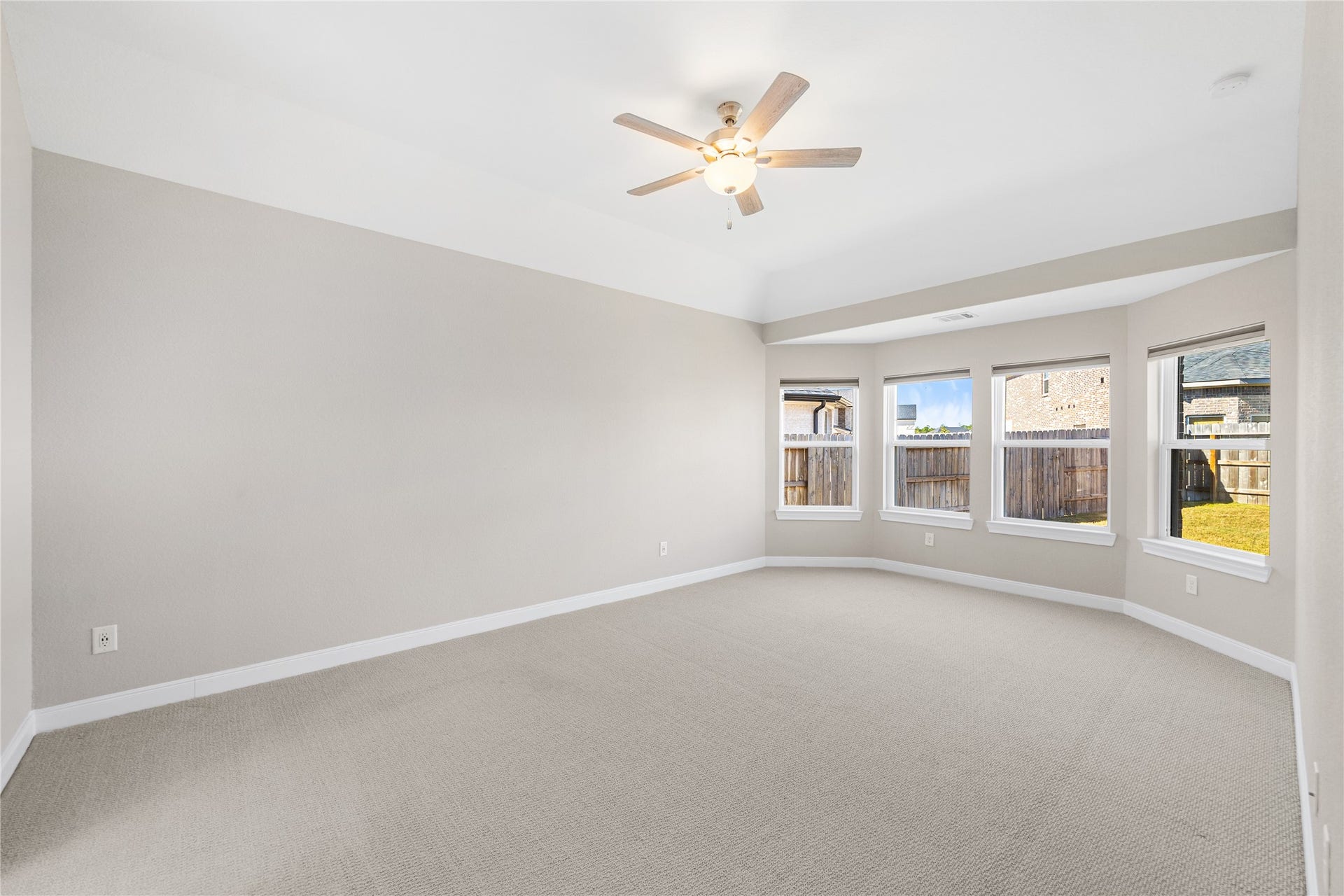 The primary bedroom is conveniently located on the first floor, just off the living room for easy access.
