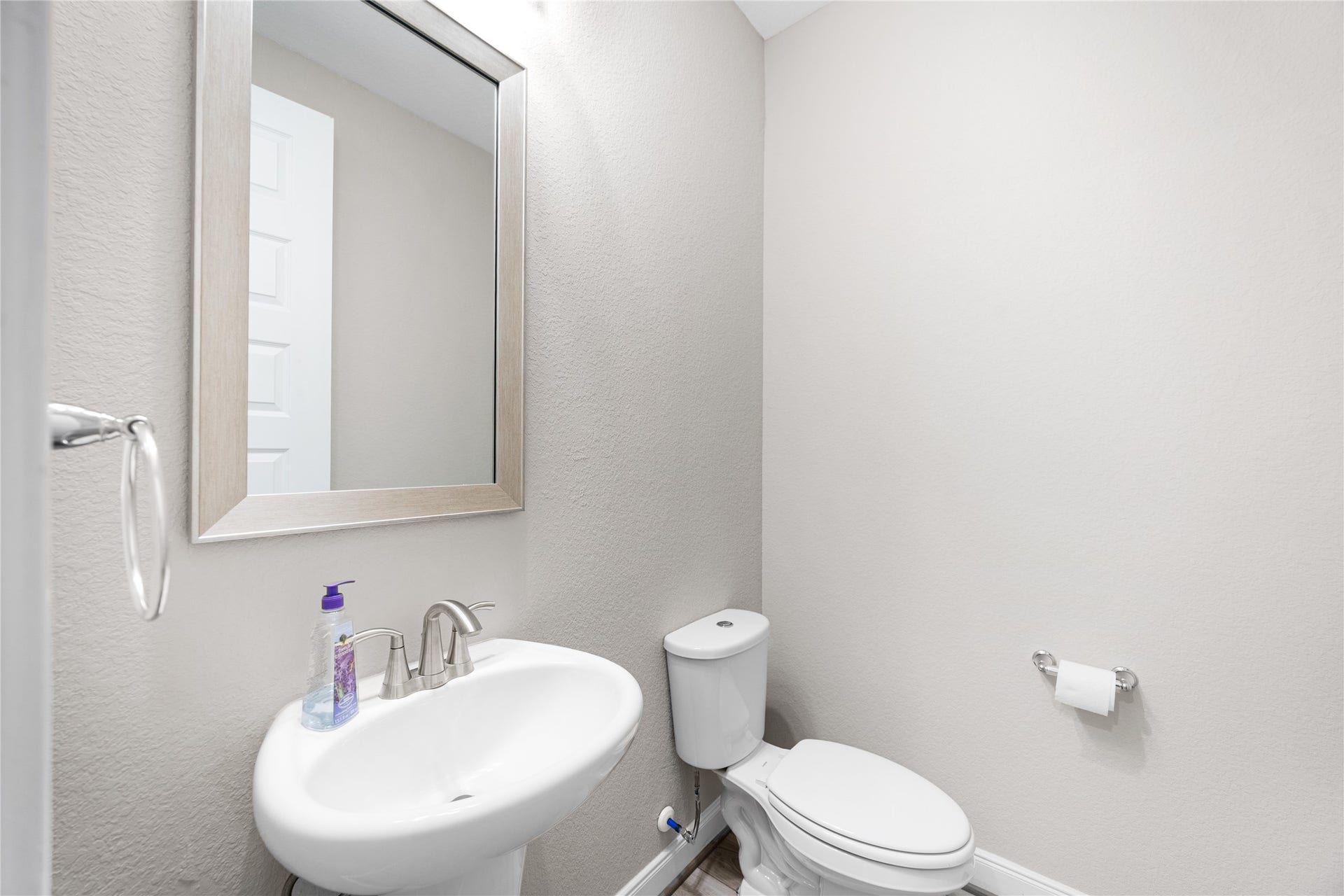The half bathroom is located on the first floor for guests and everyday use.