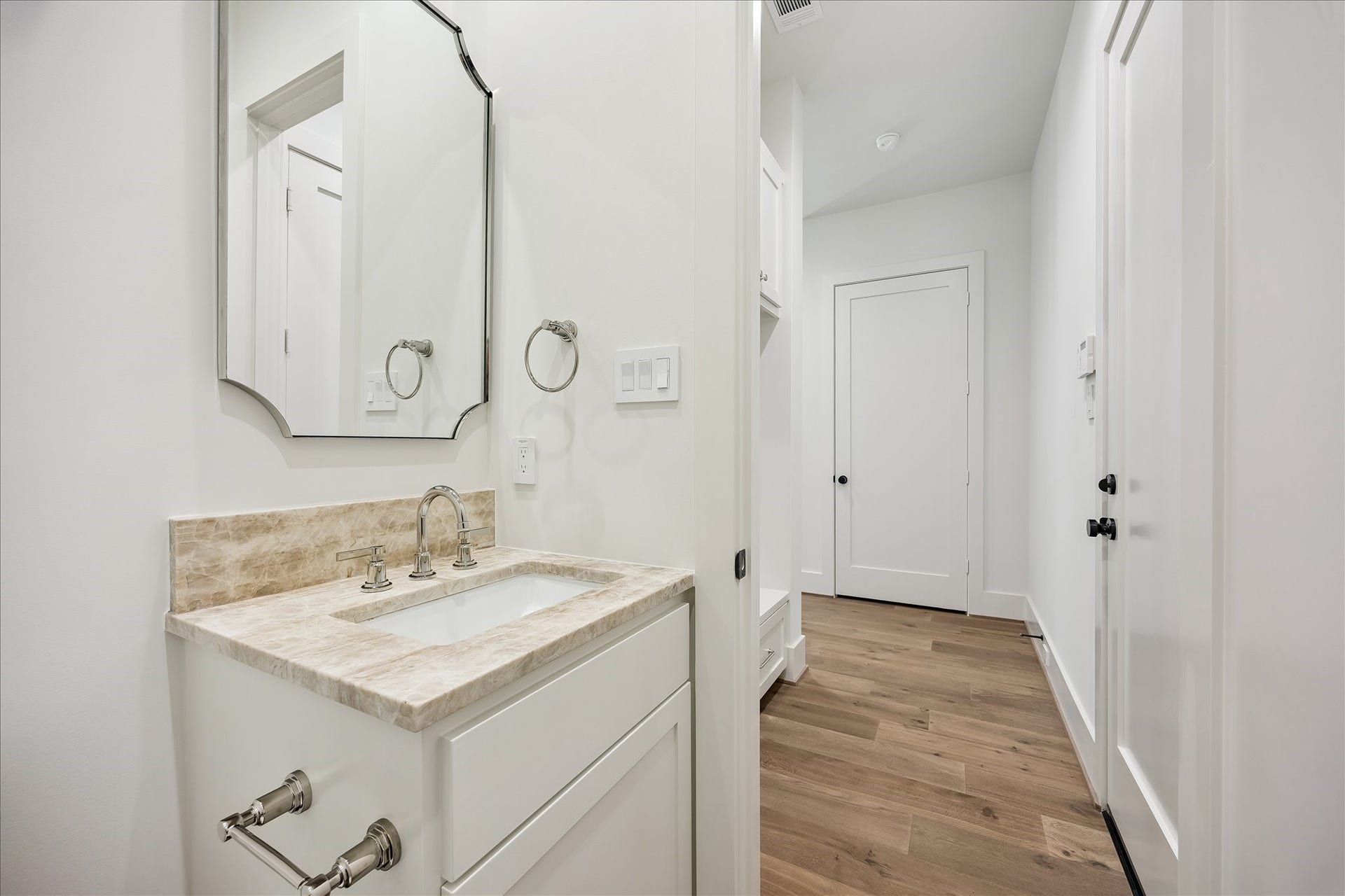 6303 Rodrigo Street, #A, Houston, TX 77007 Powder room features a stylish vanity with quartz countertop and designer mirror. This house has 2 powder rooms on first and third floor.