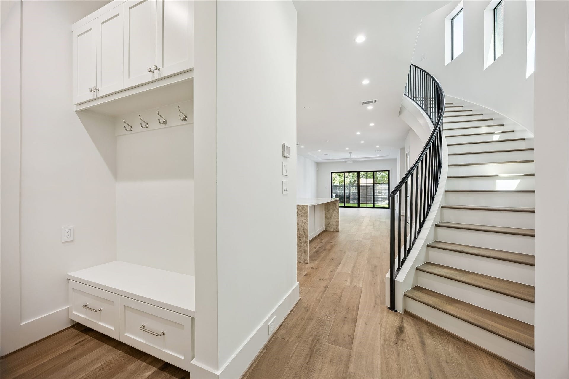 6303 Rodrigo Street, #A, Houston, TX 77007 Built-in drop zone offers cabinetry, drawers and additional storage conveniently located near the staircase.