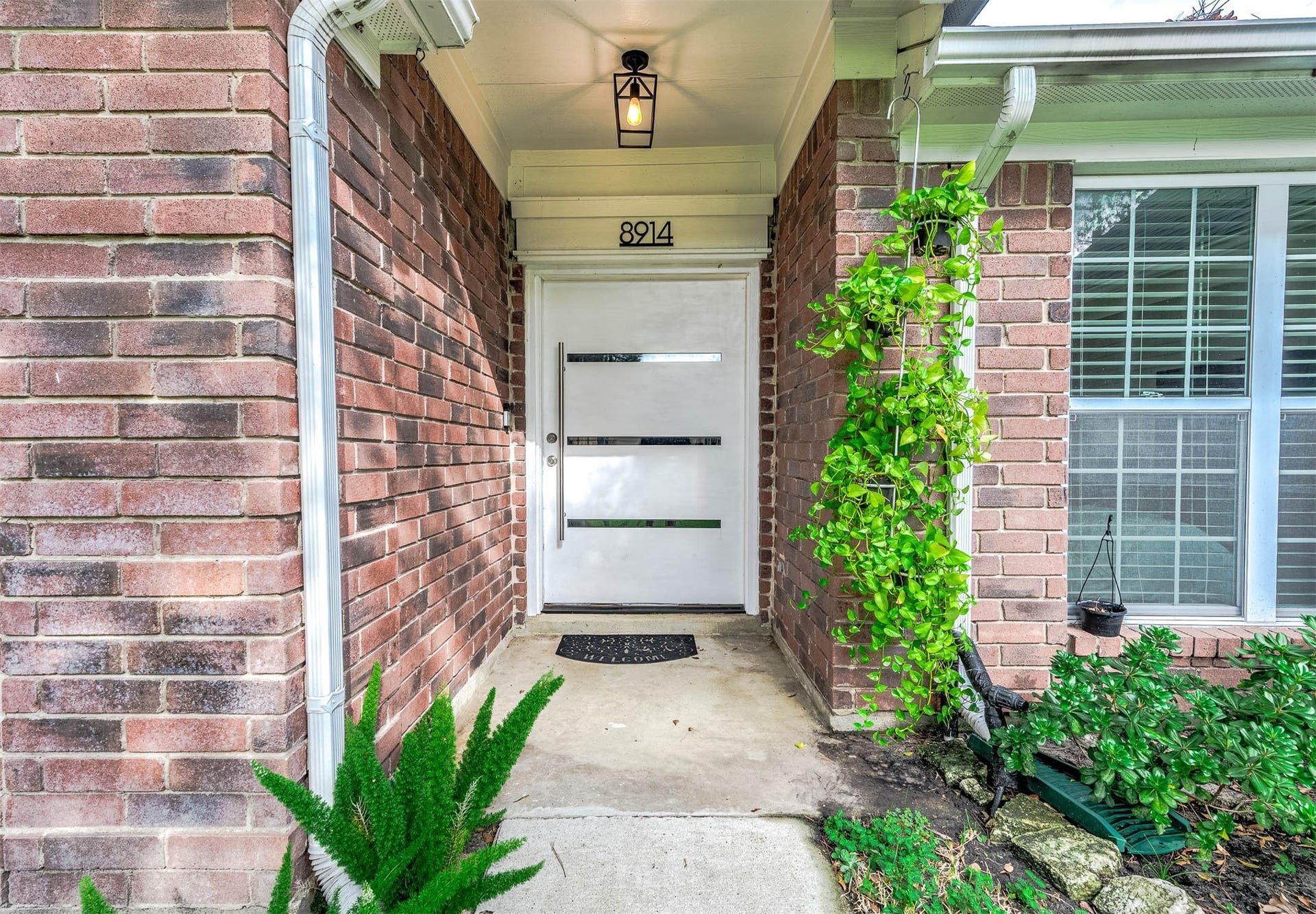 8914 Sunny Point Drive, Spring, TX 77379 Approaching the front door you will
see the beautiful brick elevation,
covered front porch, and lovely
landscaping!