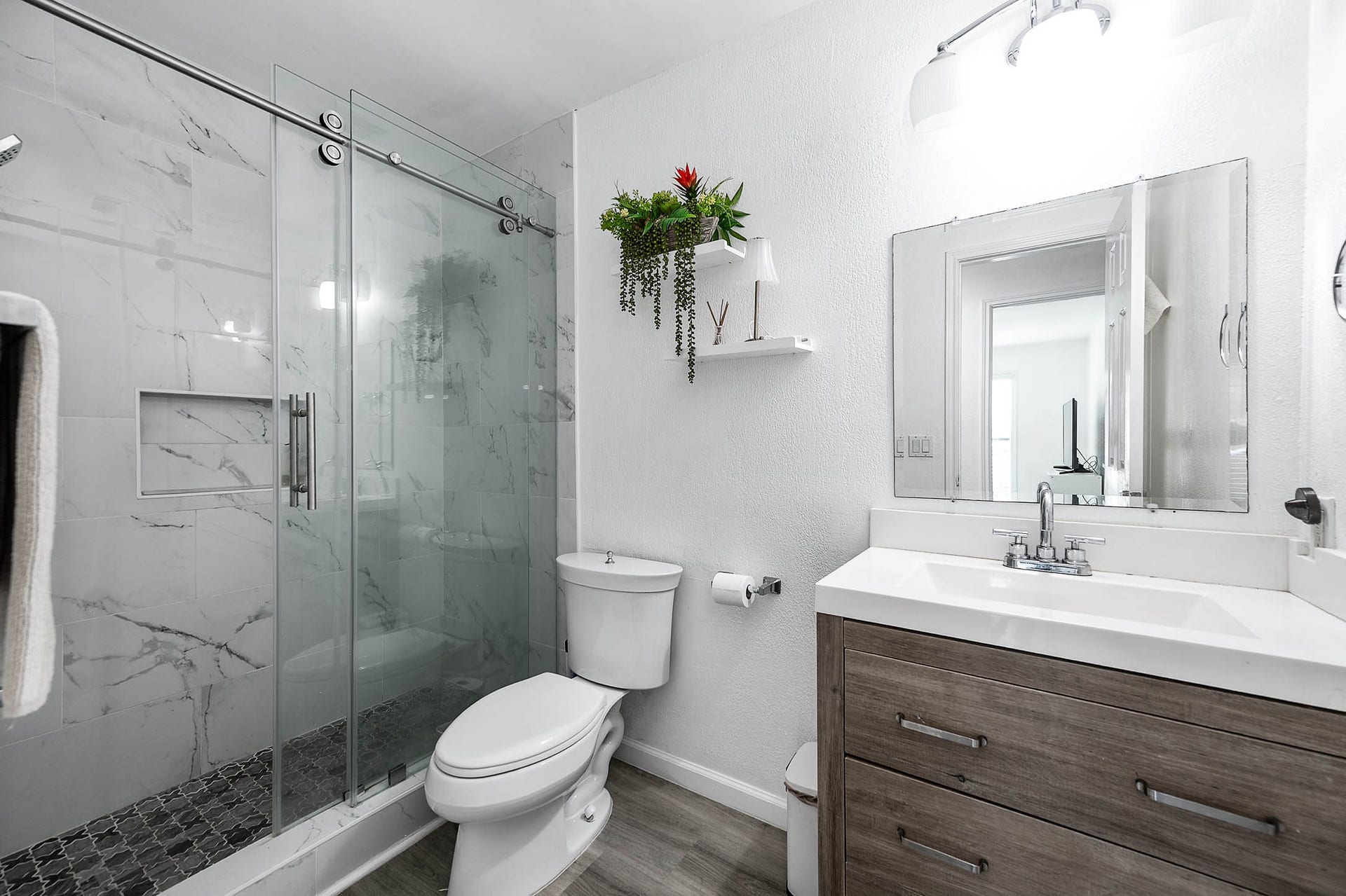8914 Sunny Point Drive, Spring, TX 77379 Secondary bathroom features light
countertops, dark cabinets, shower with tile surround
and tile floors!