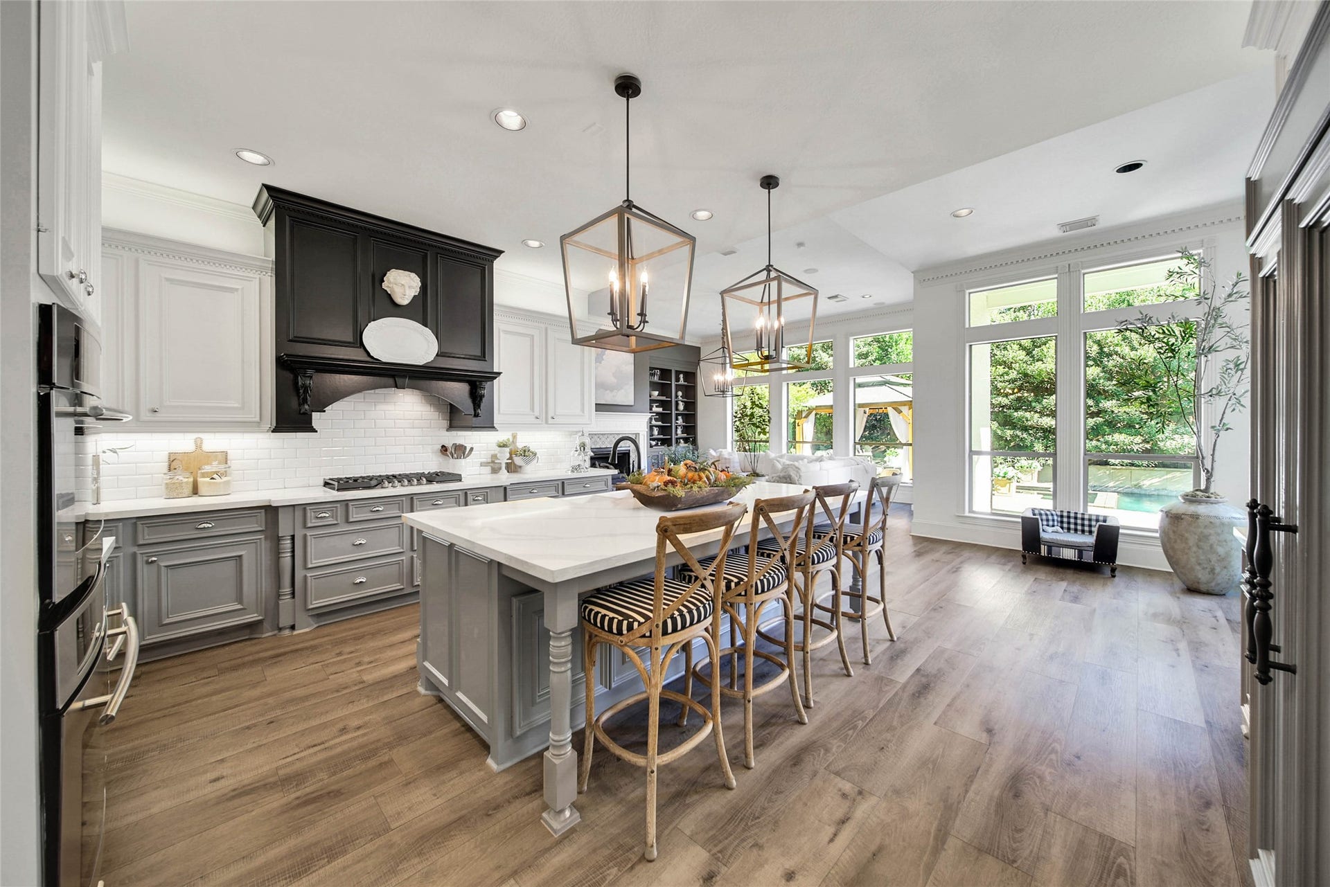 39 W Old Sterling Circle, The Woodlands, TX 77382 Stylish Kitchen features oversized island, SS appliances, Built-in Fridge and high end finishes.