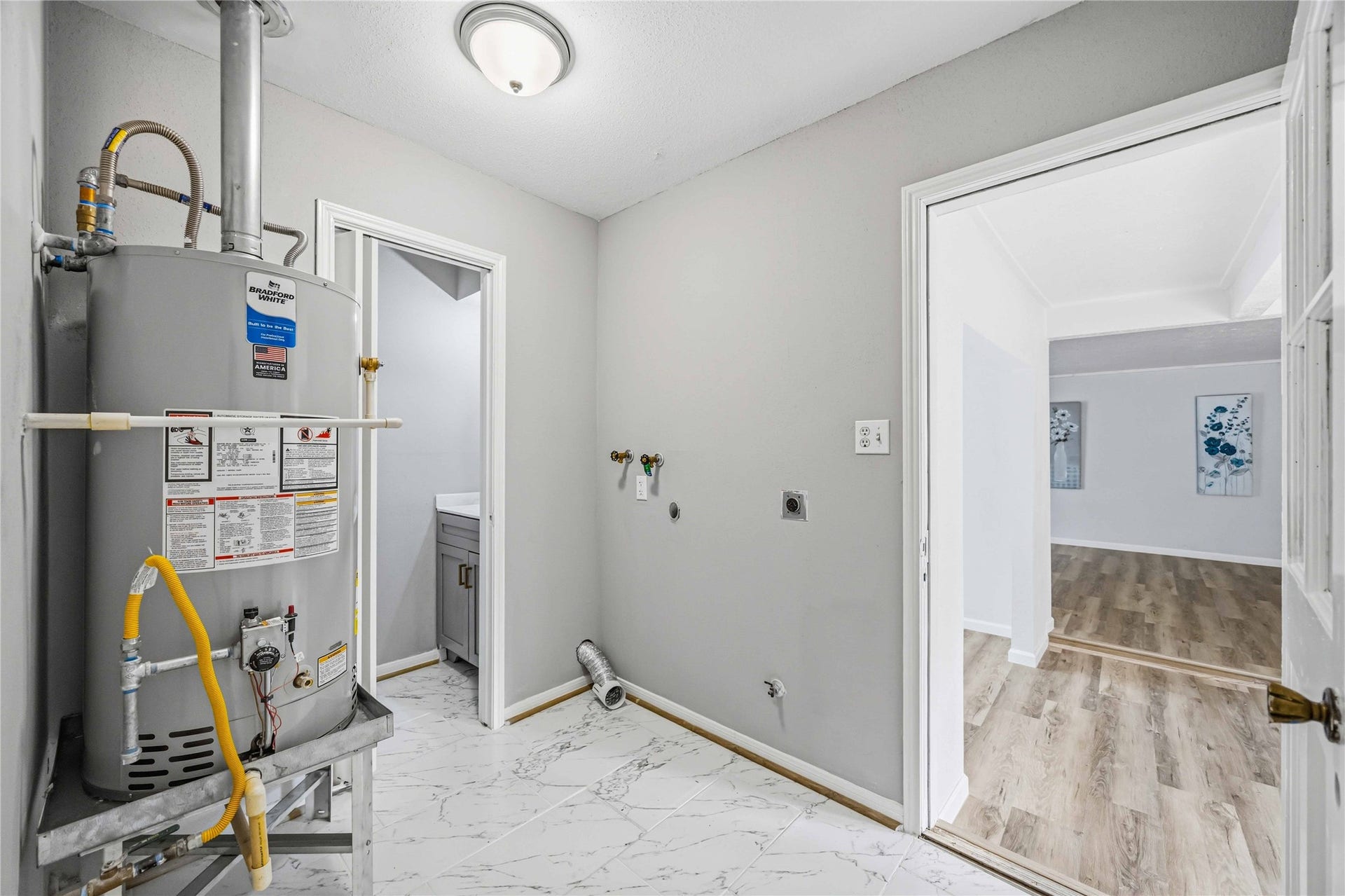 203 Wedgewood Court, Oak Ridge North, TX 77386 Utility/laundry room combined with half bath