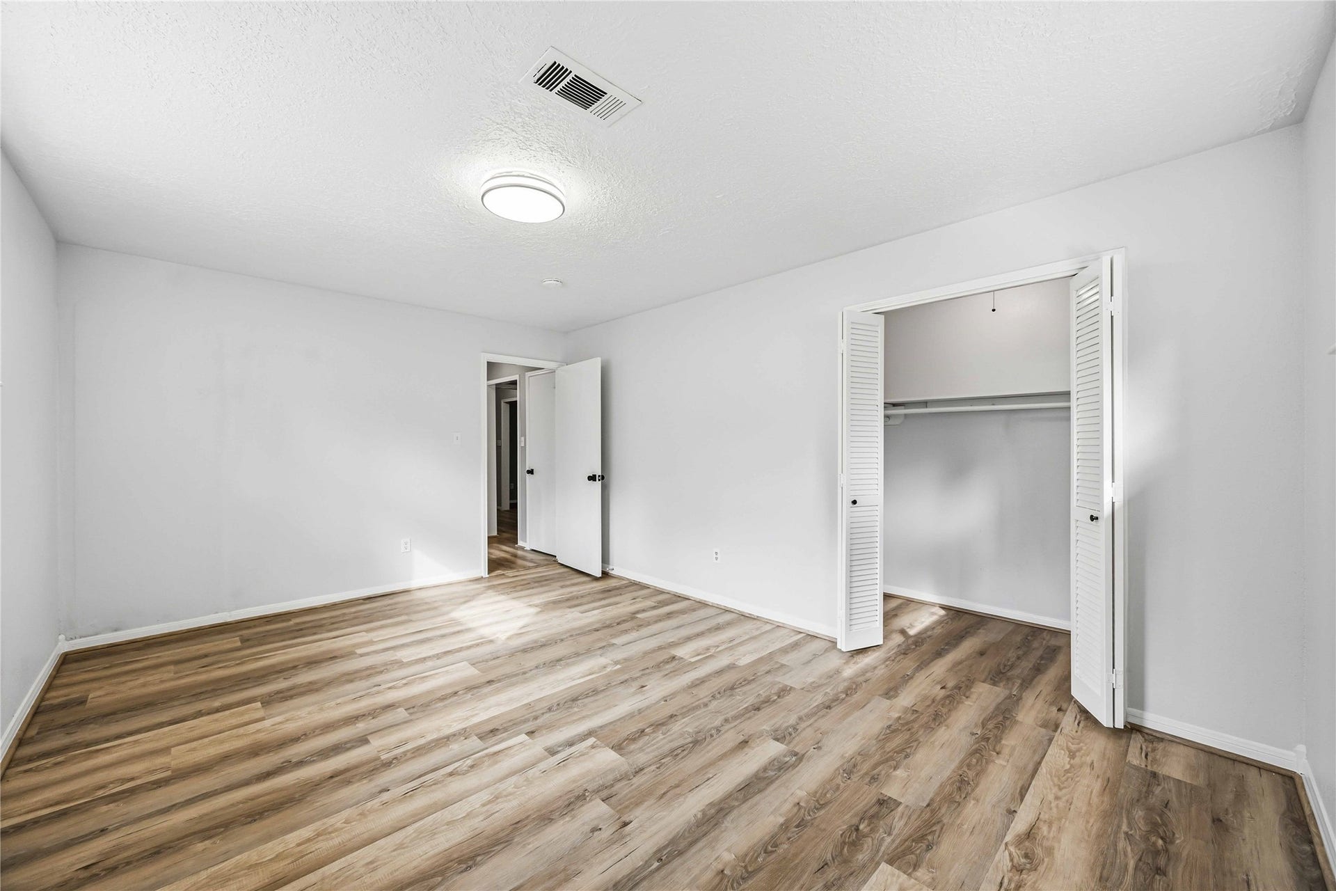 203 Wedgewood Court, Oak Ridge North, TX 77386 Another view of primary bedroom