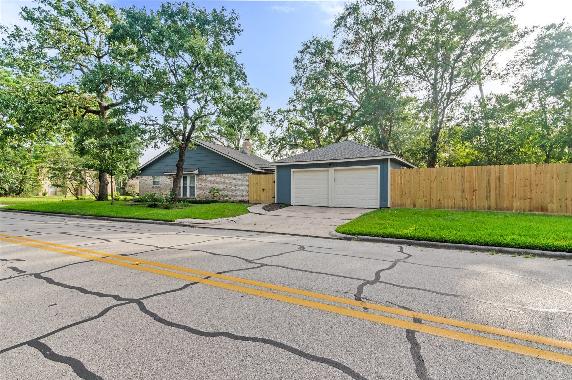 27249 Lana Lane, Oak Ridge North, TX 77385 2-car garage on corner lot