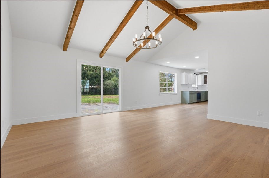 104 Oriole Lane, Angleton, TX 77515 Welcome Home! This beautifully renovated property is nestled in the peaceful Angleton area and offers modern updates with timeless charm. The inviting living space features abundant natural light, vaulted wood beam ceilings, and beautiful wood floors throughout.