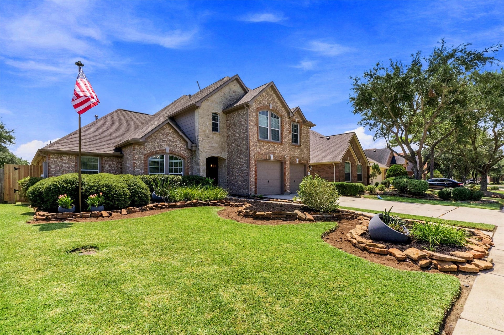 1277 Ocean Manor Lane, League City, TX 77573 Beautiful curb appeal with manicured landscaping.