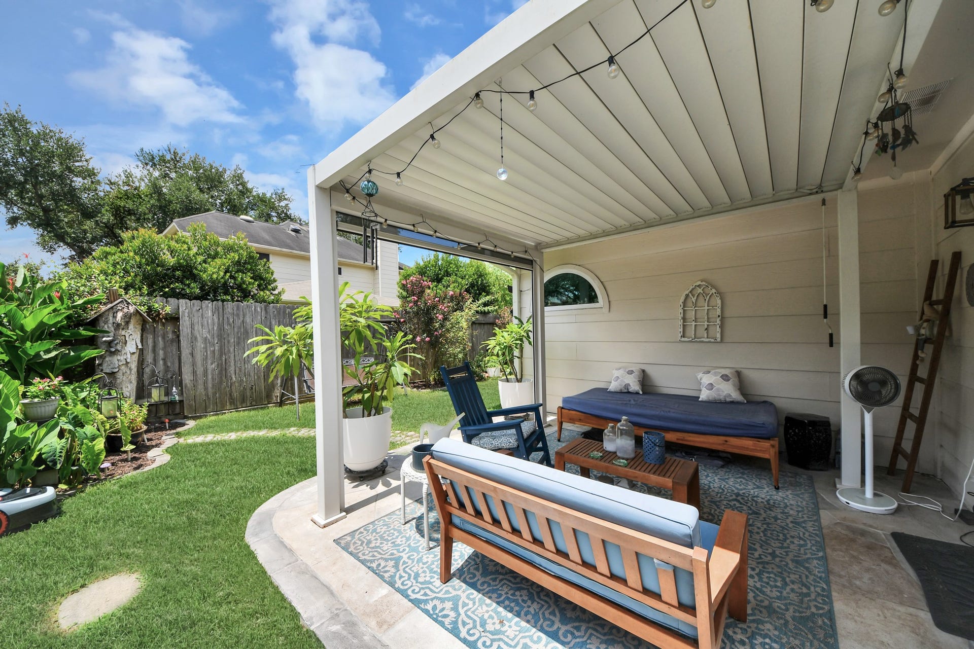 Enjoy year-round outdoor living beneath the spacious covered patio.