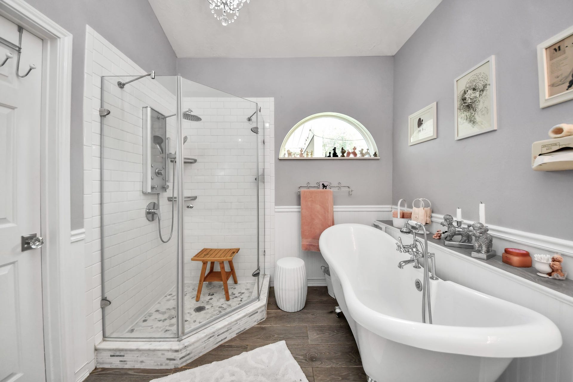 Relax in the freestanding claw-foot tub or enjoy the separate glass-enclosed shower.