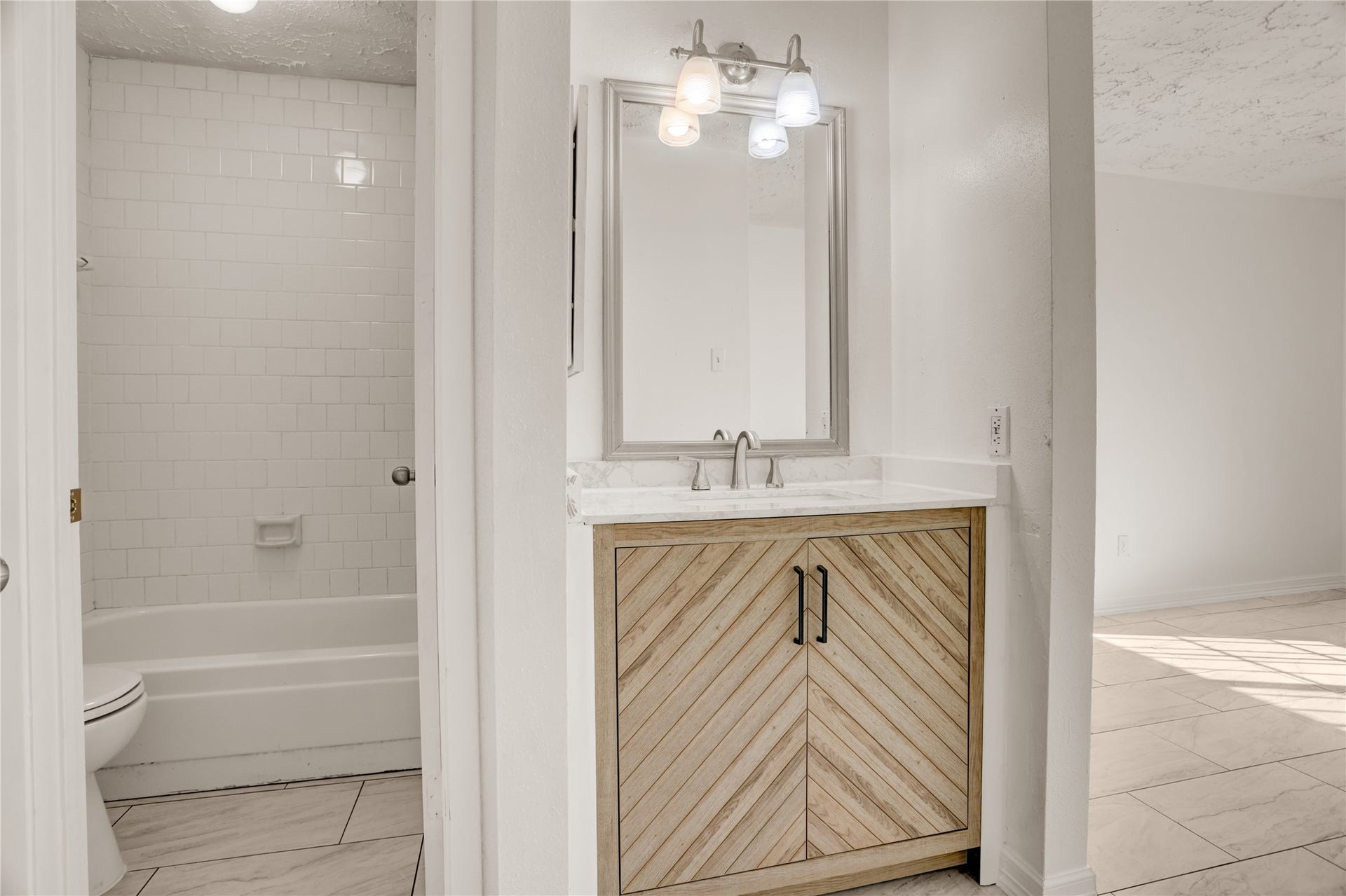 Updated bathroom with fresh finishes.