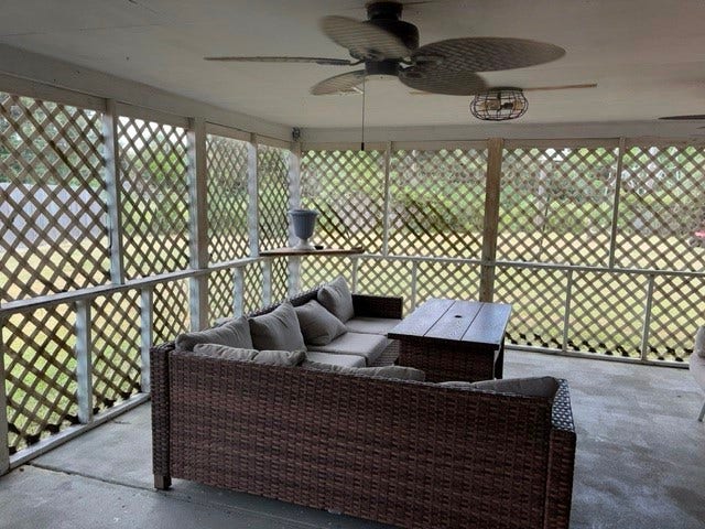 1909 11th Avenue, La Marque, TX 77568 The patio provides a great view of the large backyard and another building that has a workshop and 2 rooms with window units for crafting or hobbies.