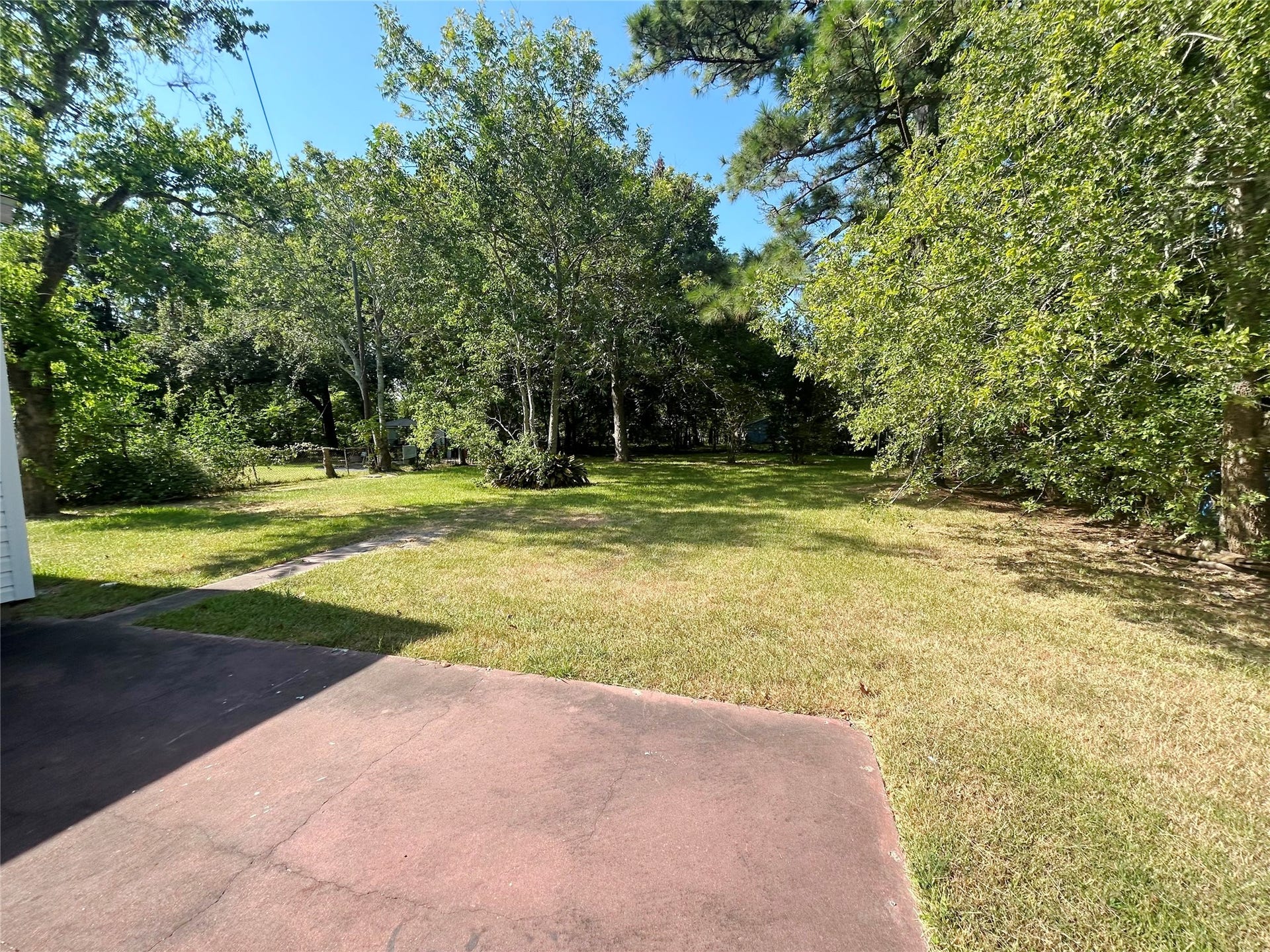 602 Bluebonnet Drive, La Marque, TX 77568 Patio overlooks a shady back yard
