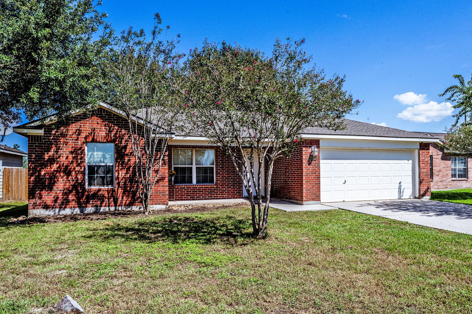 28814 Red River Loop, Spring, TX 77386 Welcome home! This single story home sits on a generously sized lot with mature shade trees, established landscaping & a sprawling front lawn. An extended driveway provides ample parking and leads to the attached garage, while the spacious front yard adds to the property's curb appeal.