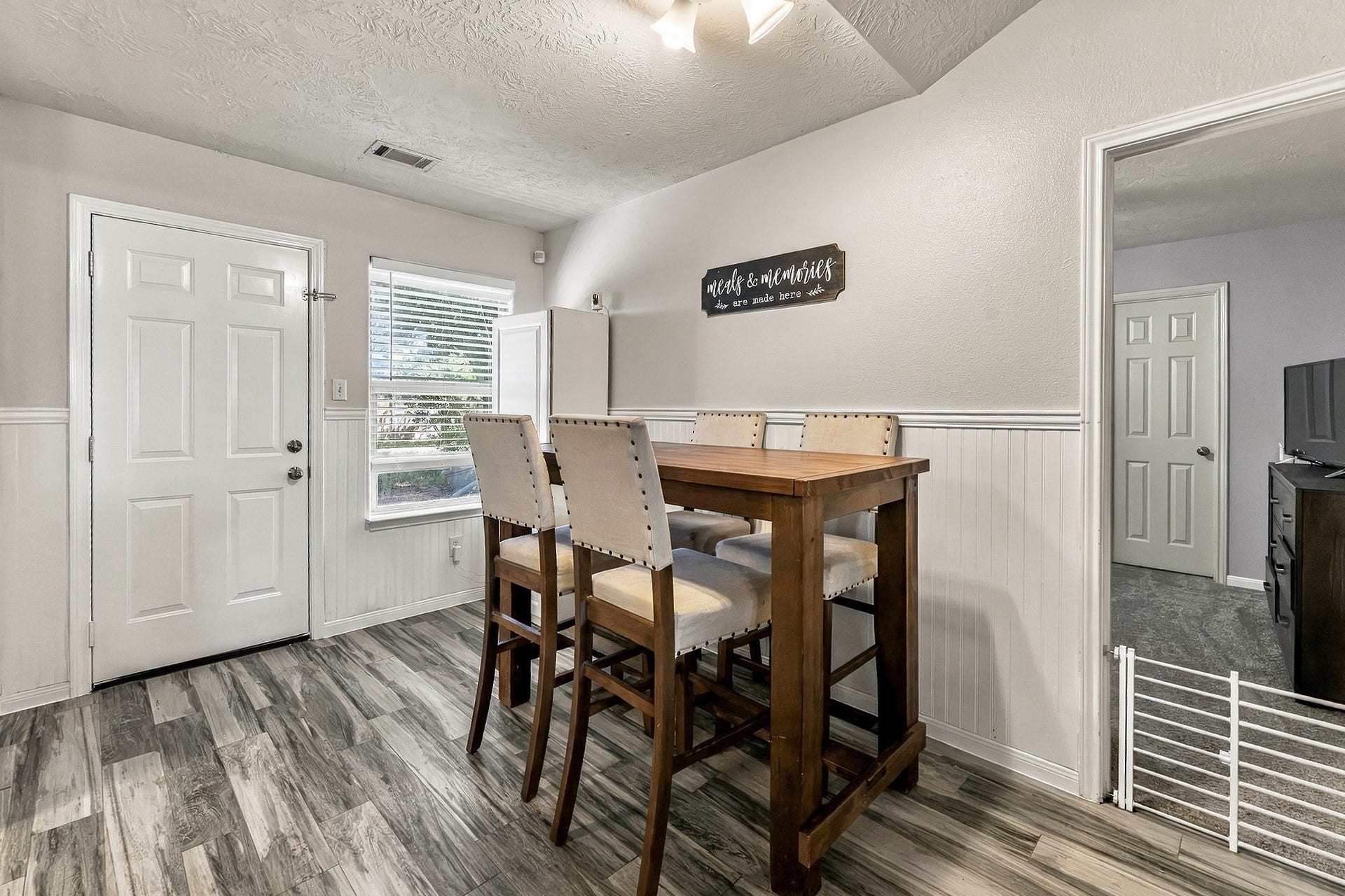 28814 Red River Loop, Spring, TX 77386 Just off the main living area, the dining room offers plenty of space for a full-size dining table, with easy access to the kitchen. A large window provides natural light, while the luxury vinyl plank flooring continues throughout the space.