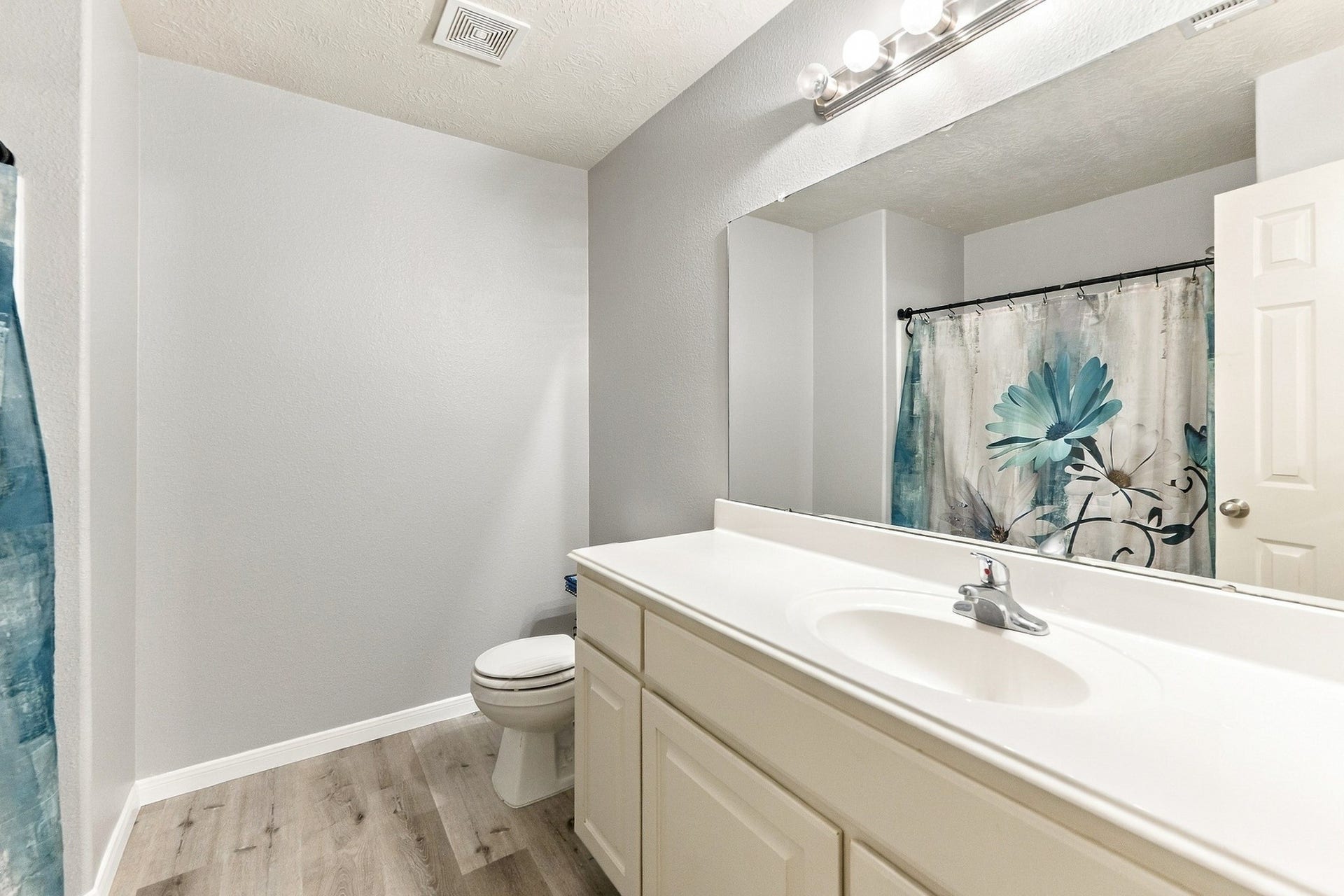 28814 Red River Loop, Spring, TX 77386 Another look at the primary bathroom highlights the generous vanity storage, neutral finishes & tub/shower combination. The clean, well-kept space offers everything needed for everyday use.
