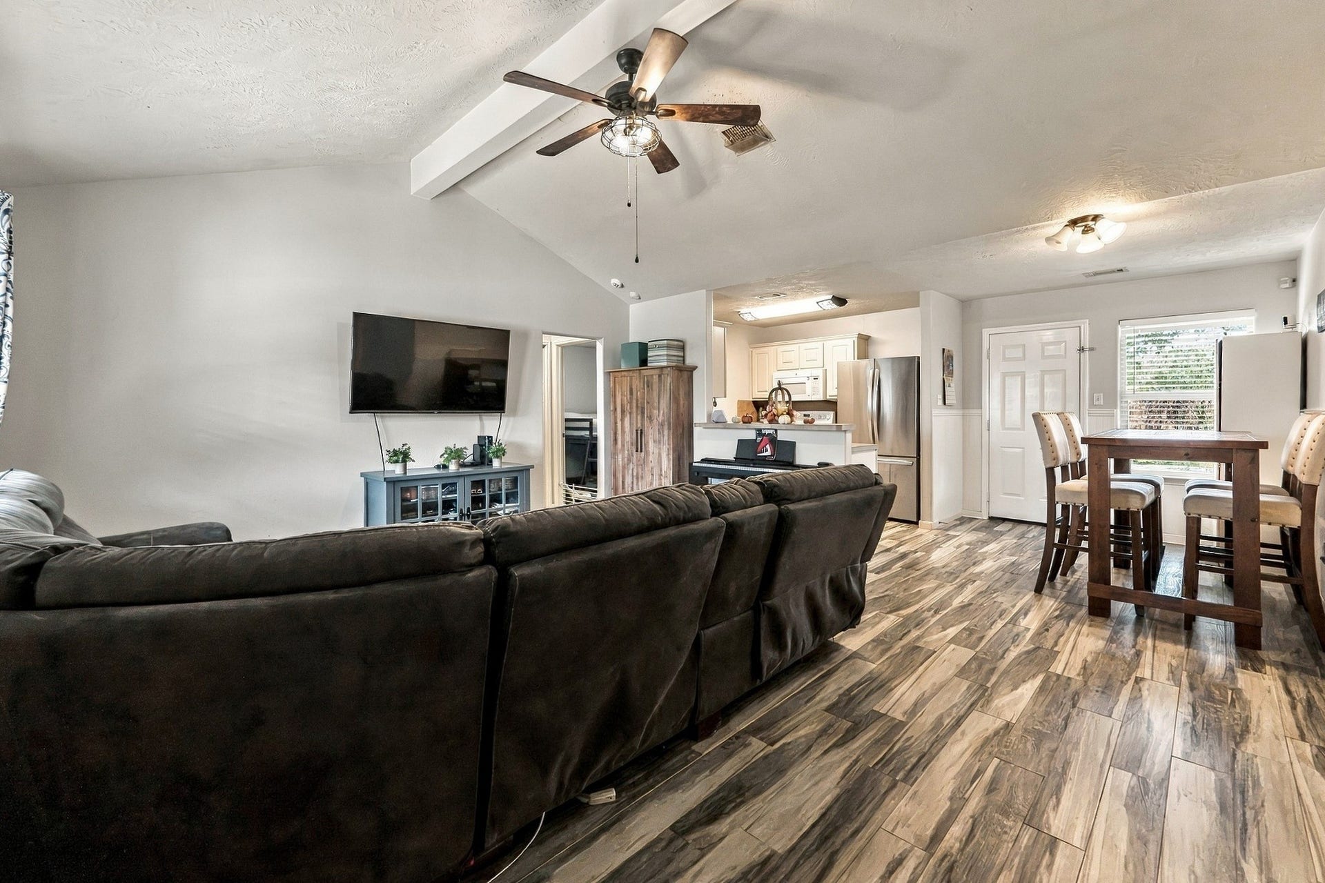 28814 Red River Loop, Spring, TX 77386 The open floor plan connects the main living area to the dining space, allowing for easy movement between rooms. Multiple windows bring in natural light, while the layout offers plenty of space for entertaining family & friends.