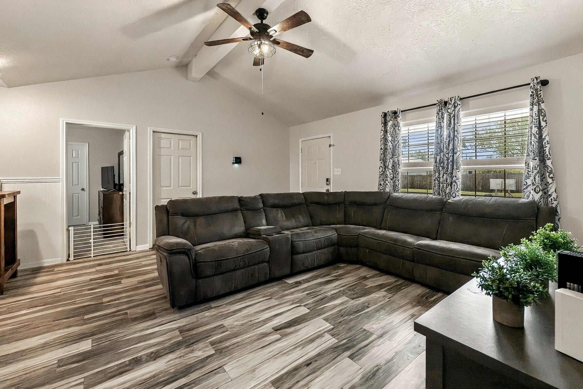 28814 Red River Loop, Spring, TX 77386 Step inside to a spacious living room with luxury vinyl plank flooring, a large front-facing window & plenty of room for oversized furniture. The neutral interior provides a great starting point for making this space your own.