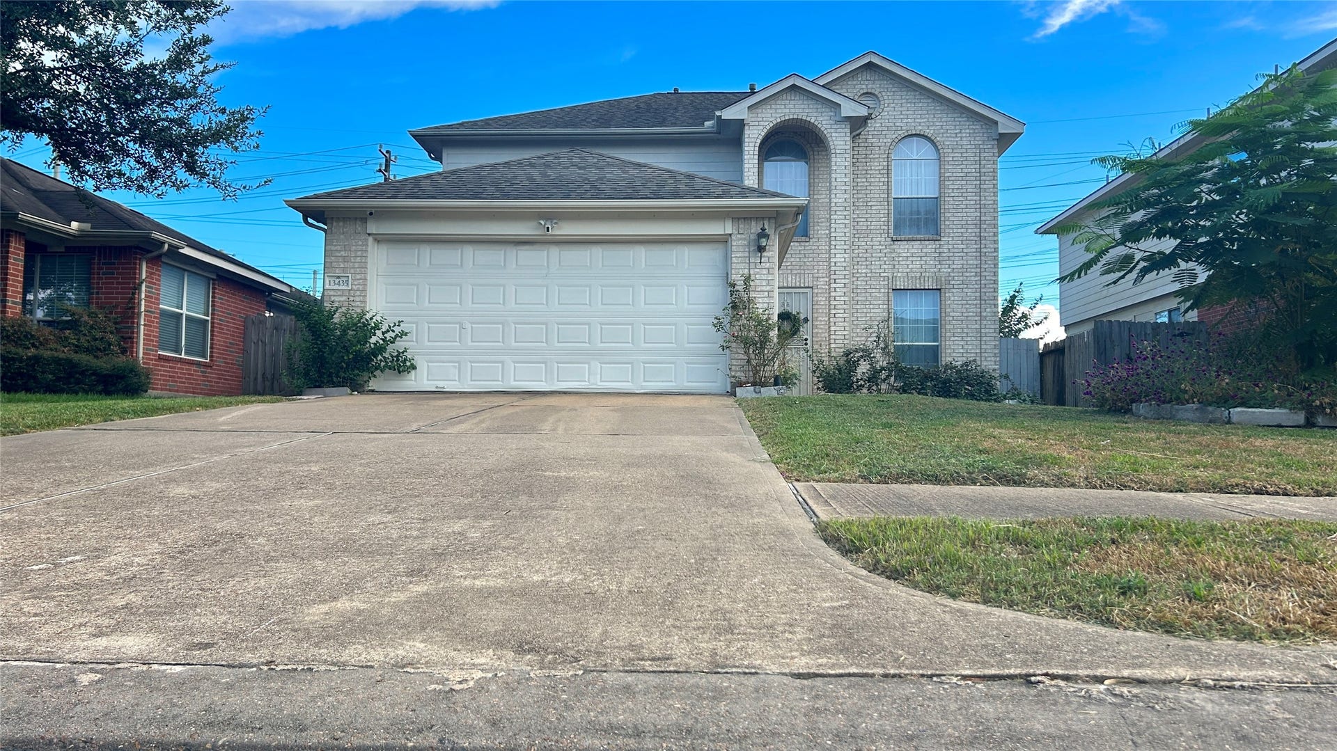13435 Bishop Way Drive, Houston, TX 77083 Stunning front exterior with exceptional curb appeal and well-maintained landscaping