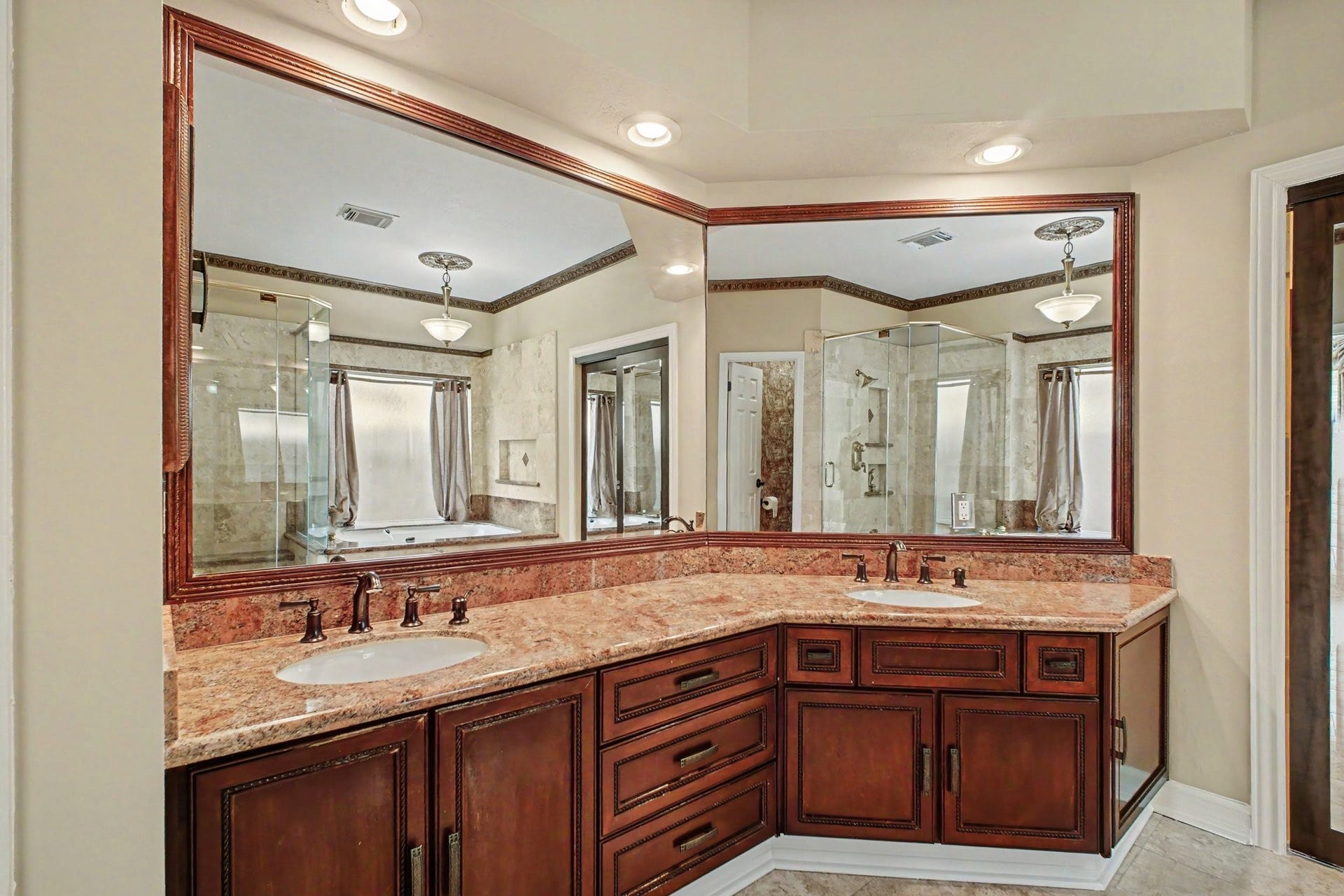 5406 Brook Bend Drive, Sugar Land, TX 77479 Extended vanity complete with dual sinks, granite countertops and plenty of storage space