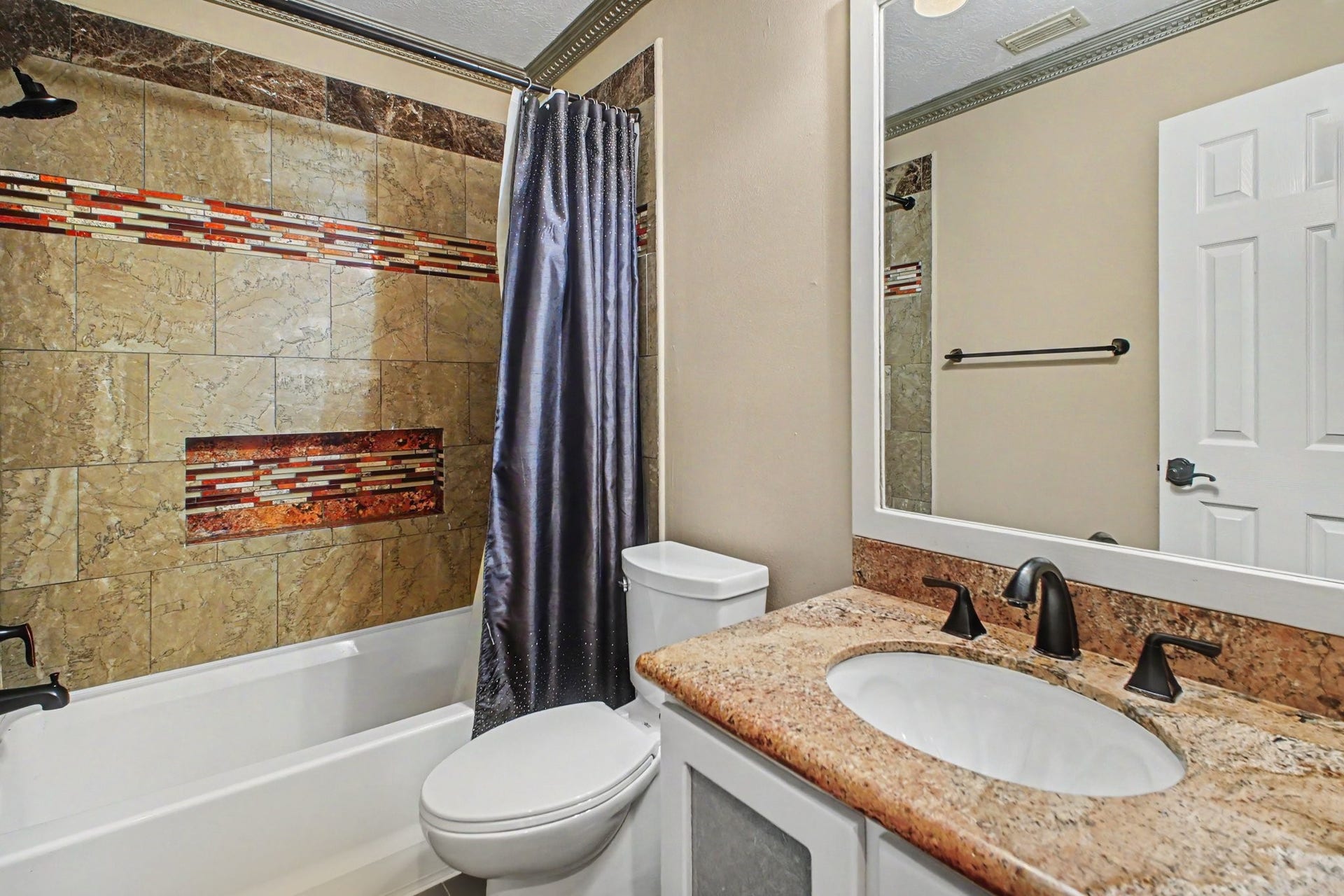 5406 Brook Bend Drive, Sugar Land, TX 77479 Full bathroom with decorative tile