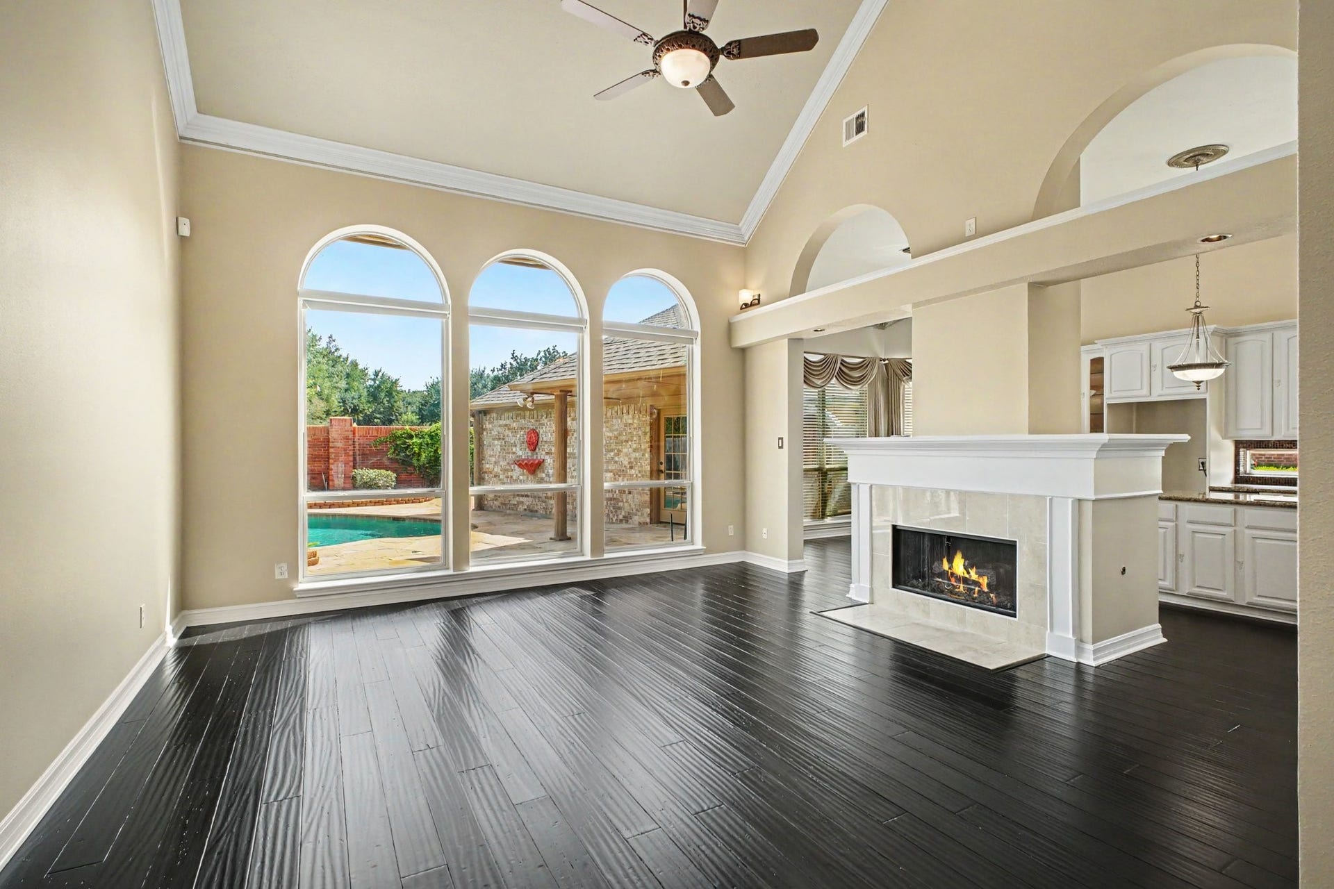 5406 Brook Bend Drive, Sugar Land, TX 77479 Rich bamboo flooring and a wall of windows with remote controlled blinds