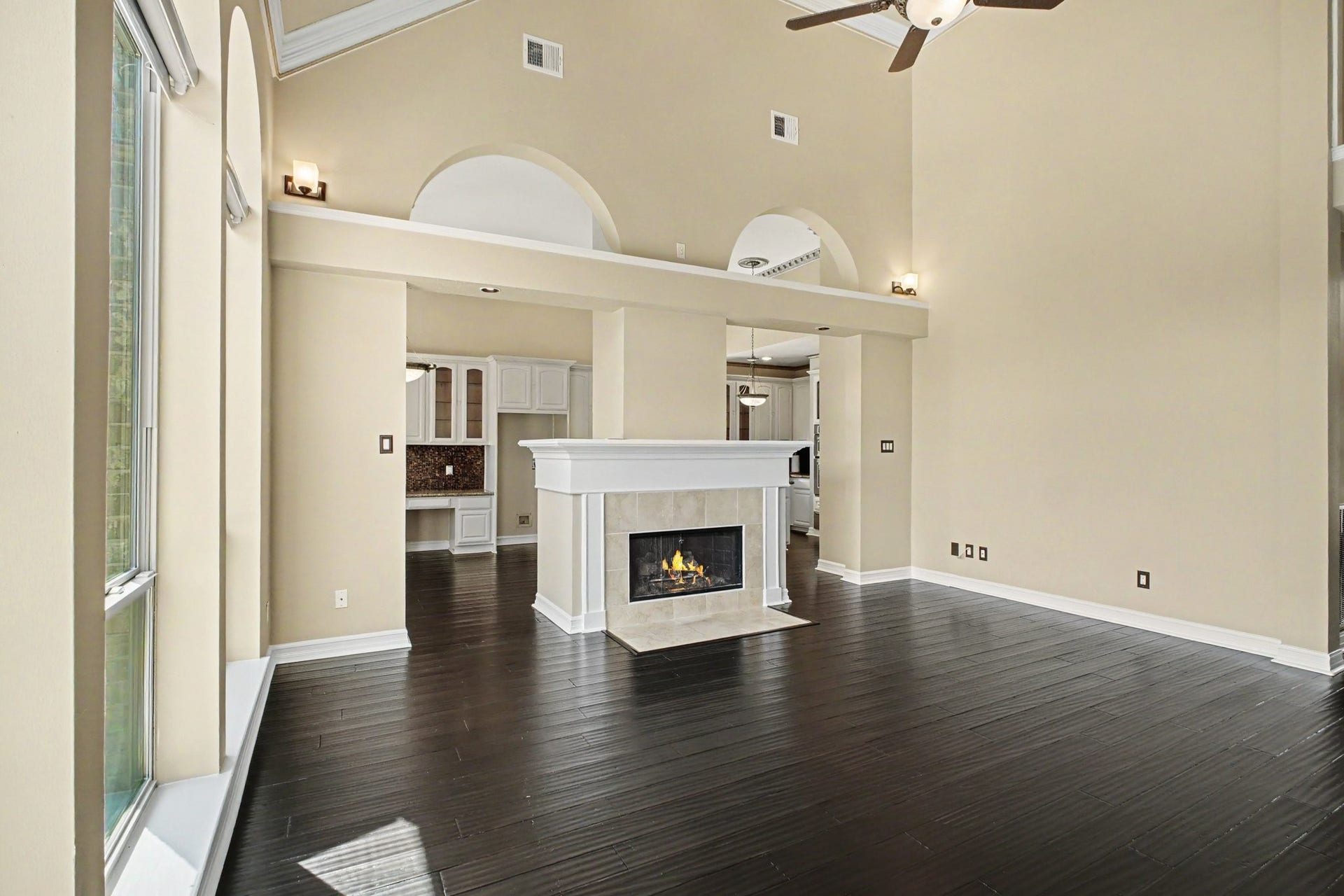 5406 Brook Bend Drive, Sugar Land, TX 77479 The fireplace serves as the focal point of the room complemented by lovely architectural details that add character and charm