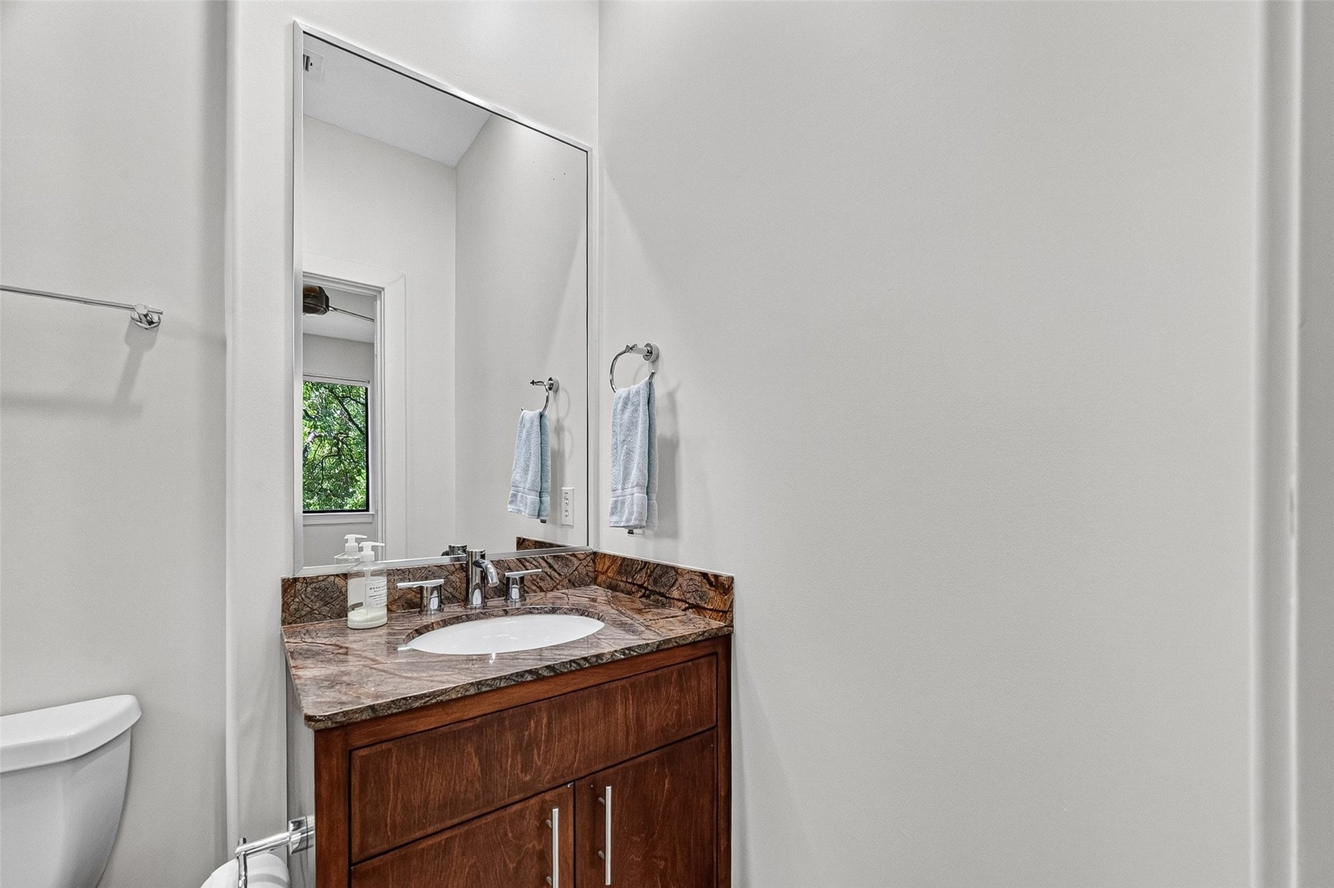 1110 Autrey Street, #C, Houston, TX 77006 Elegant bathroom in bedroom on third floor with a sleek granite countertop, and modern fixtures.