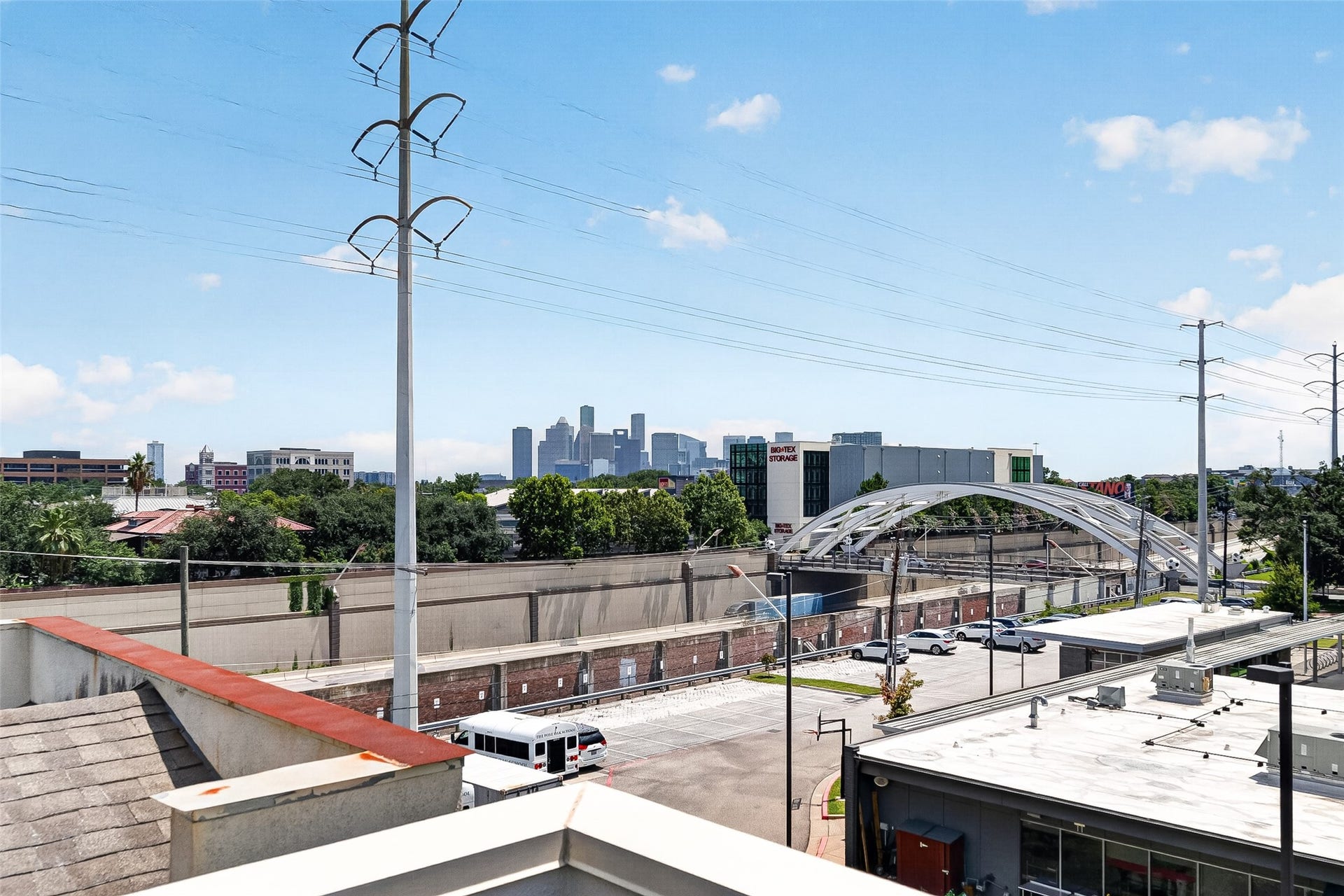 1110 Autrey Street, #C, Houston, TX 77006 Enjoy a stunning urban view featuring a modern bridge and city skyline, perfect for those who appreciate dynamic cityscapes.