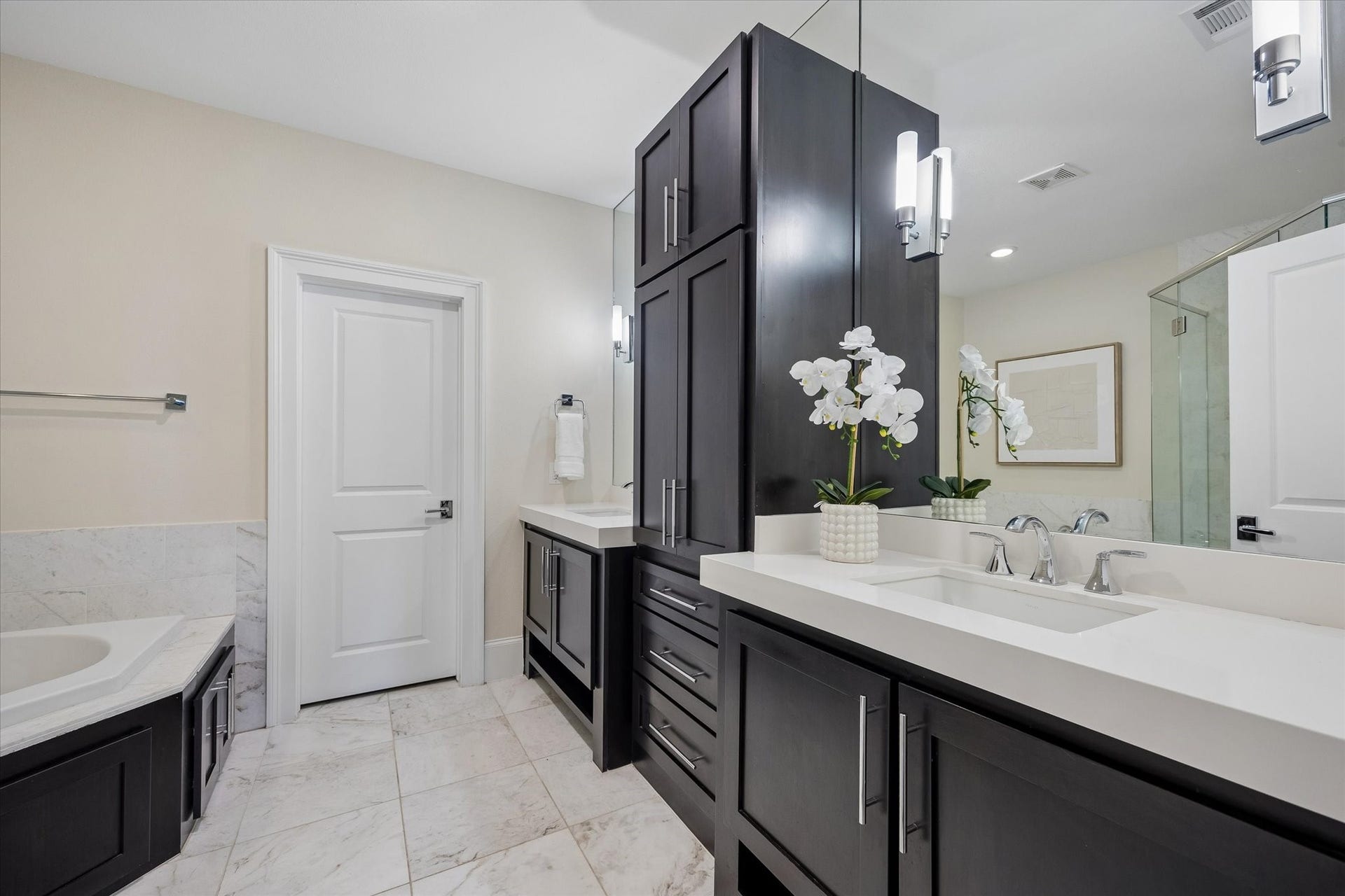 2111 Huldy Street, Houston, TX 77019 Dual sinks, generous storage, and a thoughtful layout make preparing for the day both convenient and efficient.