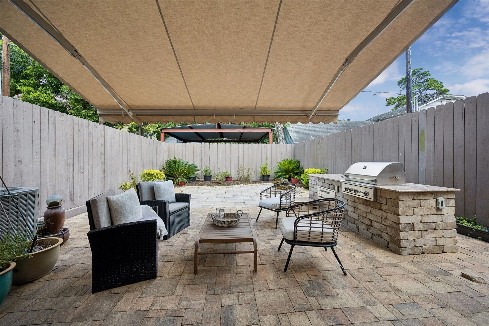 2111 Huldy Street, Houston, TX 77019 A retractable awning provides flexible shade, perfect for enjoying the outdoors during hot summer months.