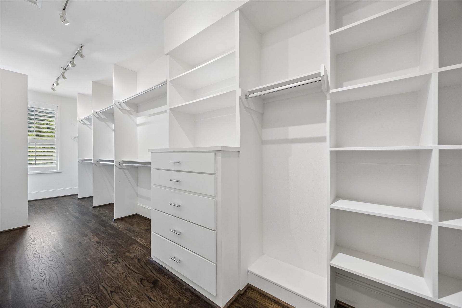 2111 Huldy Street, Houston, TX 77019 Huge walk-in closet with built-ins, offering exceptional storage and organization.